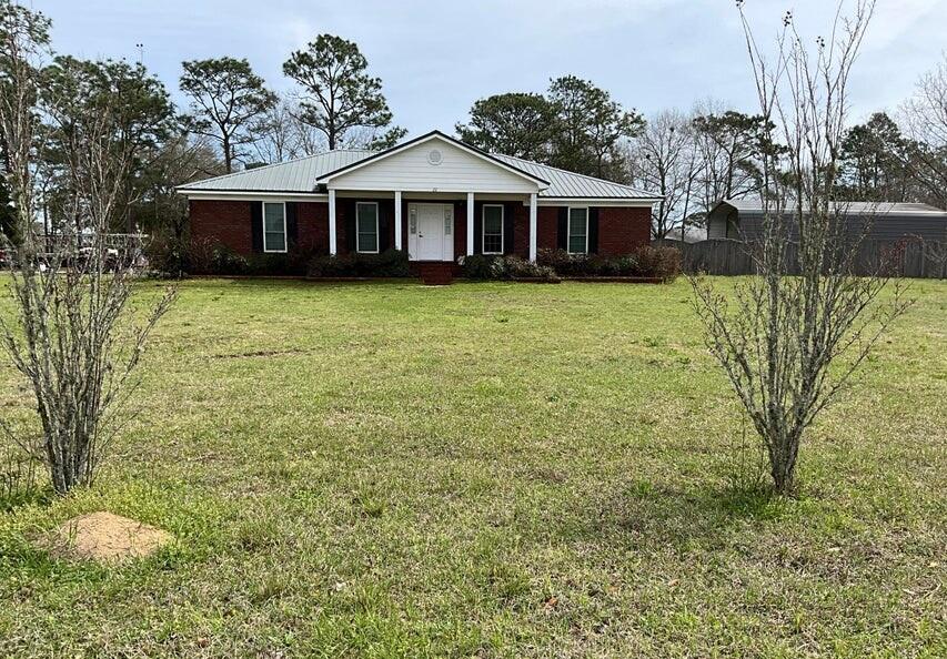 SELLER MOTIVATED,
 Lovely brick home on large corner lot a little over an acre. Total under roof 2889 square feet with 1848 square feet heated and cooled. Three bedrooms split floor plan and two full baths. Master bath has 2 walk-in closets, double vanity and a separate shower. The additional bedrooms' have walk-in closets. Hardwood and LPV throughout the home. Spacious two car garage with loads of extra parking. The Fenced (privacy fence) backyard has a 20 x 40 covered RV parking space and an additional 18 x 20 carport space. Carport space has an enclosed 12 x 18 workshop on the back. Entrance to the back yard is a double gate to allow for large RV. The home had solar panels installed in 2022 with a Tesla whole home backup battery. A new AO Smith Voltex 60-gallon commercial grade water heater ins
