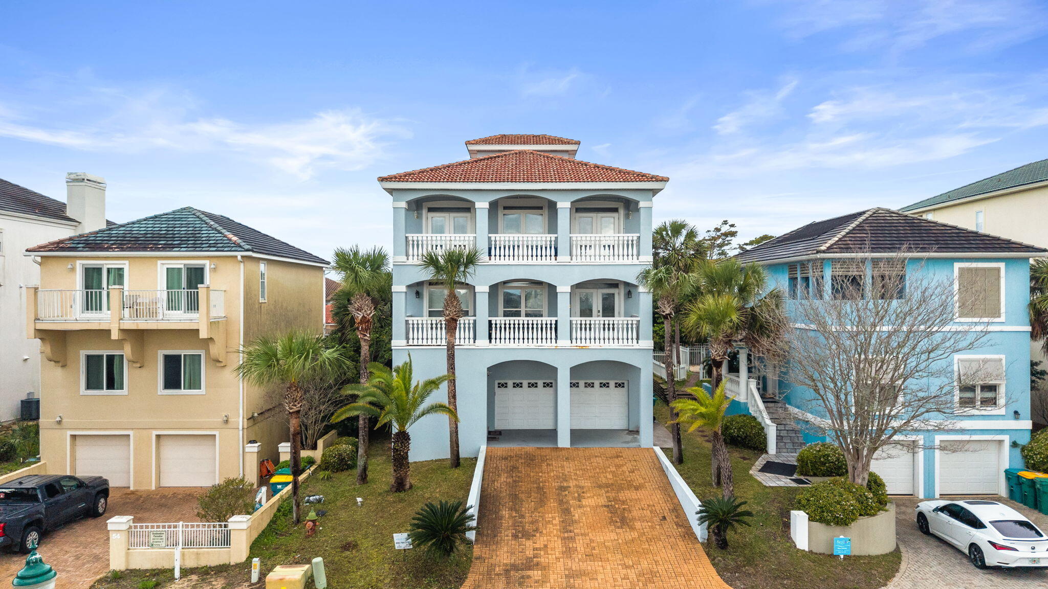 Located near the sugar-white beaches of the Emerald Coast, this beach house in Terra Cotta Terrace offers deeded beach access, a pool, tennis courts, clubhouse, and volleyball court. Close to shopping, dining, and entertainment, it features a unique hard stucco design with a covered balcony and rooftop 'Martini Deck' showcasing Gulf, bay, and lake views. The open floor plan is ideal for entertaining and can accommodate 2-3 families. The kitchen includes custom cabinetry and granite countertops. Additional features: 3 HVAC units, 2 refrigerators, washer/dryer, surround sound, insulated windows, security system, paging system, and hurricane shutters. Includes 1-year home warranty. Buyer to verify dimensions.