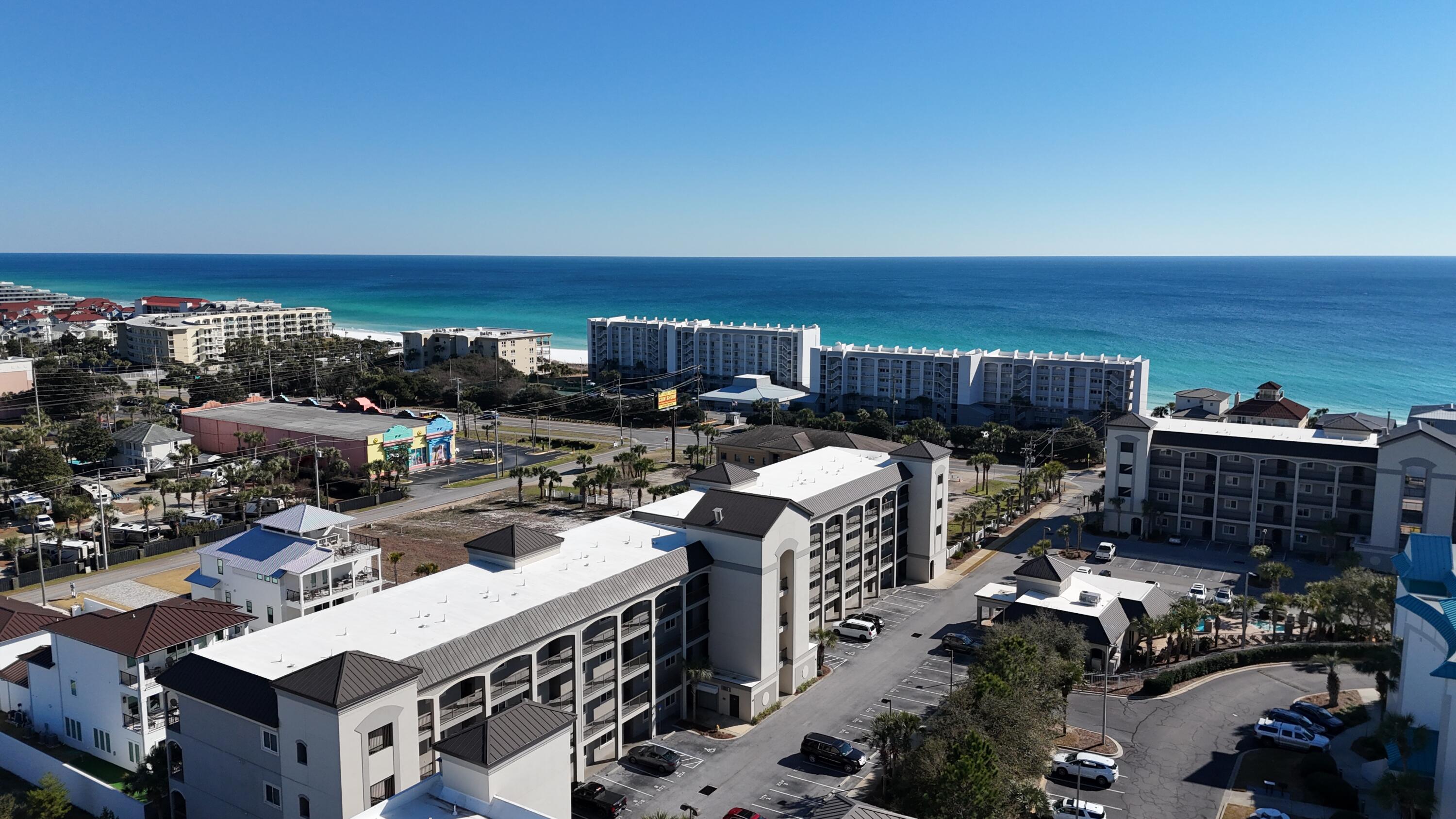 There comes a point when a vacation destination becomes more than a place you visit.
It becomes the place you can't wait to return to.
Imagine arriving in Miramar Beach on a warm Florida afternoon. The beach is just across the street. Palm trees sway in the Gulf breeze. The sound of the waves seems to slow everything down, and suddenly the stress of everyday life feels miles away.
Welcome to your place on the Emerald Coast.
From the moment you step inside, you'll feel the relaxed coastal atmosphere that makes this property so special. Natural light fills the space, creating an open and inviting environment designed for gathering, relaxing, and making memories with the people who matter most.
The kitchen naturally becomes the center of each day. Mornings begin with coffee before a walk on the beach. Afternoons are spent preparing meals after hours in the sun. Evenings become opportunities to reconnect with family and friends while sharing stories from another perfect day along the Gulf.
The living area was designed for exactly that kind of lifestyle. Whether you're entertaining guests, enjoying a quiet night in, or simply unwinding after a day at the beach, the open layout creates a comfortable flow throughout the home.
Then there is the balcony.
The moment you step outside, you'll understand why buyers fall in love with Miramar Beach. Gulf views stretch into the distance while warm coastal breezes remind you that you're exactly where you want to be.  AIt's the perfect place to start your morning, end your evening, and enjoy every moment in between.
The primary suite offers a peaceful retreat after a day spent exploring the coast, while additional accommodations provide comfortable space for family and guests. Thoughtfully maintained and ready to enjoy, the property also features a brand-new HVAC system, providing peace of mind and comfort for years to come.
Beyond the residence itself, Alerio offers the resort-style amenities that make every visit feel like a getaway. The gated community features a beautiful pool, gathering spaces, playground, and convenient beach access just steps away from one of the most sought-after stretches of shoreline on the Emerald Coast.
When you're ready to venture out, some of the area's most popular attractions are just minutes away. Spend an evening at Baytowne Wharf, enjoy waterfront dining, explore local entertainment, or shop at Silver Sands Premium Outlets. Everything that makes Miramar Beach one of Florida's most desirable destinations is right at your fingertips.
For some, this will be the perfect second home. For others, it will become a beach retreat where family traditions are built year after year. And for many, it represents an opportunity to own a piece of the lifestyle that draws people to the Emerald Coast from all over the country.
Because you're not simply purchasing a property near the beach.
You're investing in a place where life slows down, memories are made, and every visit feels like exactly where you're meant to be.