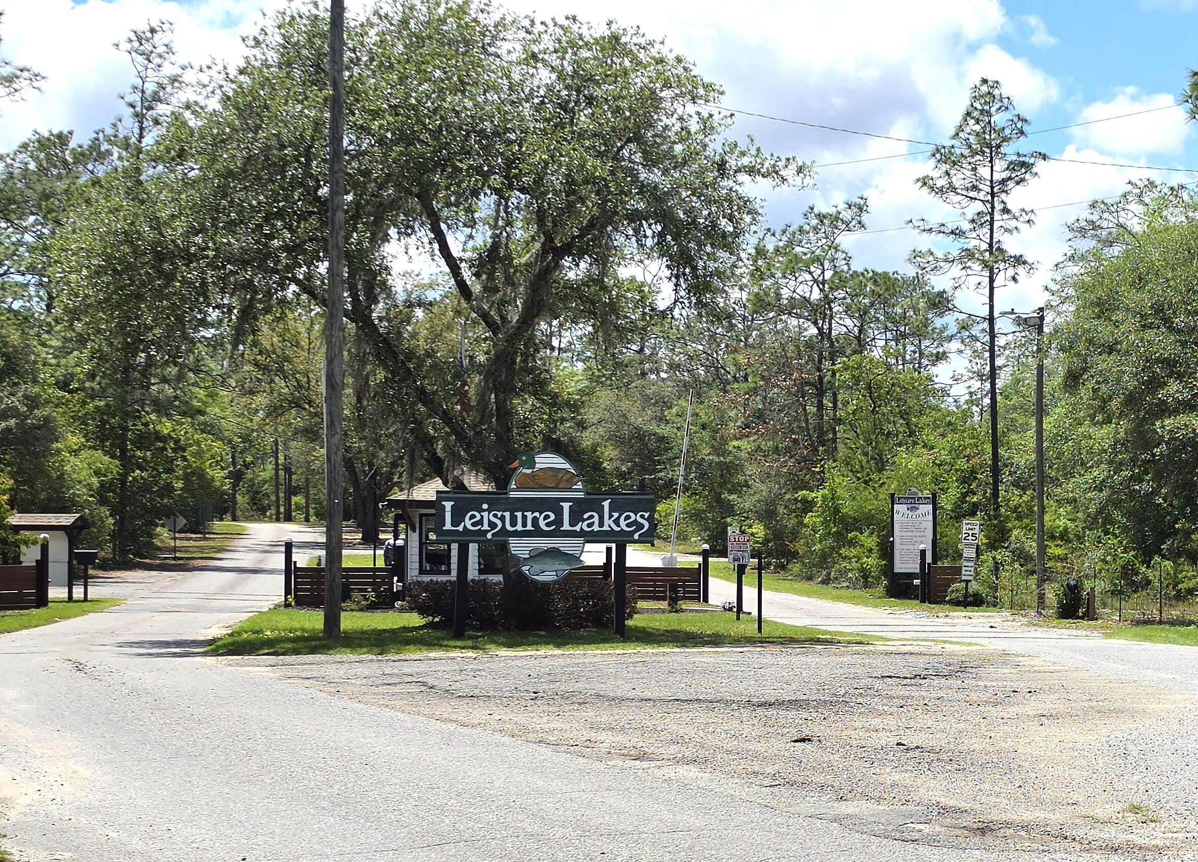 Build your dream home on this beautiful 1.7-acre wooded homesite tucked away on a quiet cul-de-sac in the desirable Leisure Lakes gated community. Enjoy privacy, peaceful surroundings, and plenty of space while still being just about 30 minutes from Panama City. Surrounded by nature and featuring two beautiful spring-fed lakes, Leisure Lakes offers a relaxed lifestyle with an impressive selection of amenities, including a community pool, tennis courts, playground, fishing, picnic areas, lake access, and more. Whether you're looking for a primary residence or investment opportunity, this spacious lot offers endless potential in a serene setting with plenty of room to enjoy the outdoors. All measurements are approximate and should be verified by buyer.