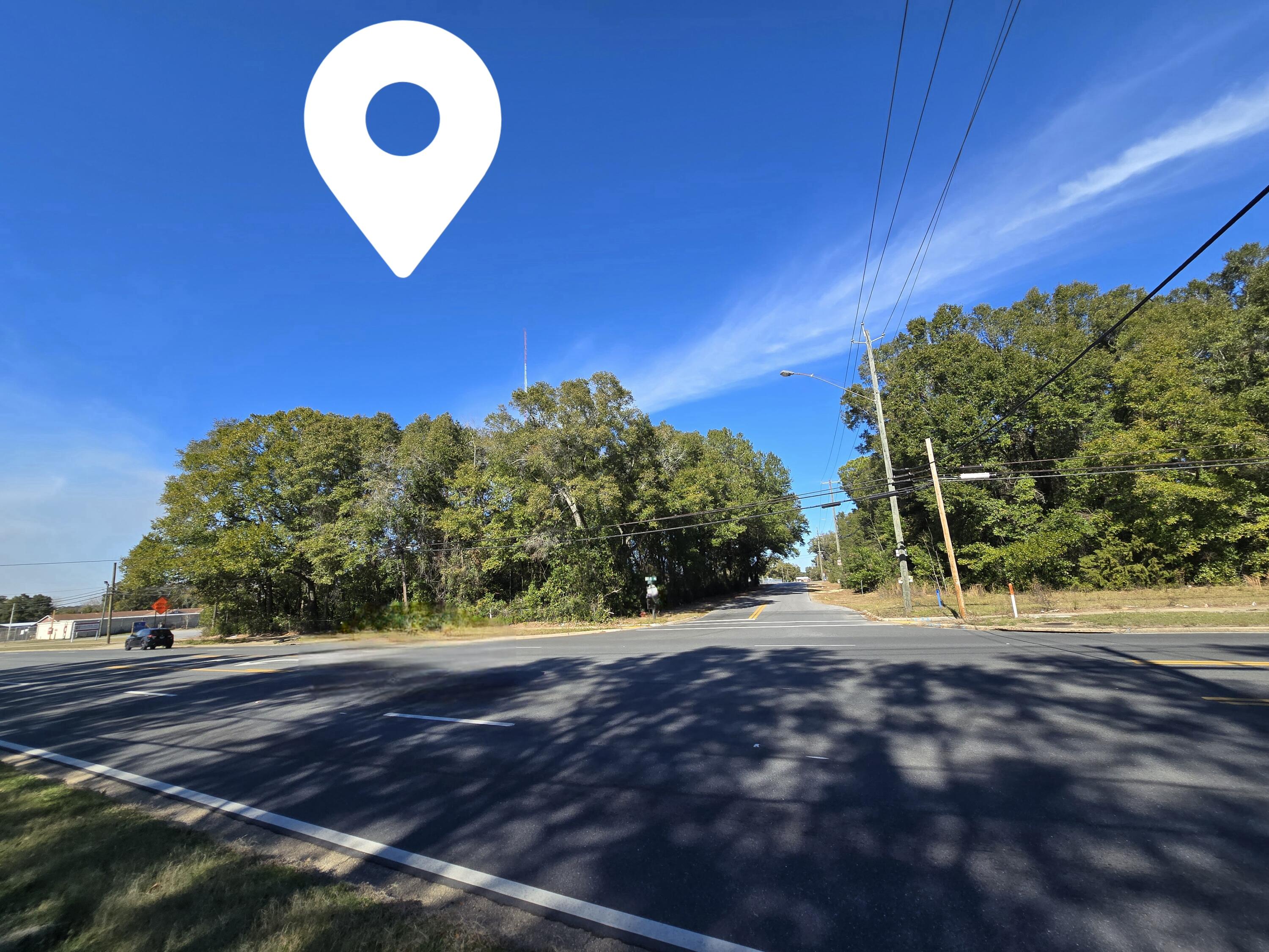 BEAUTIFUL COMMERCIAL CORNER LOT IN CRESTVIEW, FL! Exceptional opportunity to own over half an acre with approximately 150 feet of frontage on highly traveled US Hwy. 90 W. Ideally located just a few blocks from downtown Crestview and busy Hwy. 85 N, offering excellent visibility and accessibility for your future business venture. Perfect location for retail, office space, professional services, or investment development. High traffic exposure and convenient access make this property a prime commercial opportunity in a growing area. Don't miss your chance to secure this valuable corner lot! Survey available.