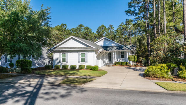 Charming Single Story Home Backing to Conservation Area - Mostly furnished & Move In ready Come see this beautifully maintained single story 3 bedroom 3 bath Bellis plan offering 2,222 sq. ft. of refined living in the sought after front section of Watersound Origins.Set on a premium lot backing to a serene, wooded conservation area, this home delivers privacy, tranquility, and the perfect backdrop for indoor outdoor living.With ample space to add a pool, the property is ideal for those seeking both comfort and future flexibility.Step inside to discover a thoughtfully designed open layout enhanced by hardwood floors throughout marble in all bathrooms, and an abundance of natural light.The living room features a striking fireplace with marble surround, creating a warm and inviting focal poin The kitchen is appointed with marble countertops, under cabinet lighting, an extended island, a large walk in pantry, and an additional multi shelved double door storage closet--perfect for the home chef or entertainer.
All three bedrooms are generously sized, and each bathroom is finished with the same elegant marble surfaces found throughout the home. The laundry room includes built in cabinetry along with an LG washer and dryer for added convenience.
Enjoy peaceful mornings and relaxing evenings on the screened porch and a  gas firepit in the backyard adds yet another inviting space for gathering and entertaining.  And there is a gas connection and cement pad ready for an outdoor grill.
The 2½ car side entry garage offers exceptional functionality with an epoxy floor, utility sink, and plenty of room for storage, a workshop area or a golf cart.  Additional upgrades include an entire house water filtration system, electronic dust filter, and a new air conditioner/heater, ensuring comfort and efficiency year round.
This home is being offered mostly furnished with a few exceptions and truly move in ready.
A rare combination of thoughtful design, premium finishes, and a coveted conservation backed lot--this property is an exceptional opportunity in Origins.  
The Watersound Origins lifestyle is hard to beat.  Enjoy the Davis Love III designed golf course and golf is included in HOA. It's just a short walk from this home to the Watersound Origins Golf Course, resort style pool, fitness center, tennis, pickleball courts, and playground. There are miles of nature trails, and dock access to Lake Powell, the largest of Florida's rare coastal dune lakes where you can launch your canoe, kayak or paddle board. The beach is just five minutes away. The Watersound Town Center features a Publix Grocery Store and numerous shops and restaurants, along with Scenic Highway 30A, put world class dining within easy reach. Wonderful neighbors and a short-term rental restricted community create the neighborhood feel that makes this place so special.