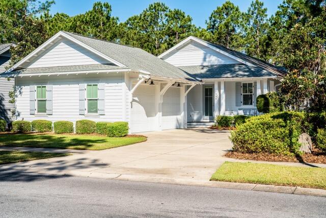 Charming Single Story Home Backing to Conservation Area. Come see this beautifully maintained single story 3 bedroom 3 bath Bellis plan offering 2,222 sq. ft. of refined living in the sought after front section of Watersound Origins.Set on a premium lot backing to a serene, wooded conservation area, this home delivers privacy, tranquility, and the perfect backdrop for indoor outdoor living.With ample space to add a pool, the property is ideal for those seeking both comfort and future flexibility.Step inside to discover a thoughtfully designed open layout enhanced by hardwood floors throughout marble in all bathrooms. The living room features a striking fireplace with marble surround, creating a warm and inviting focal point. The kitchen is appointed with marble countertops, under cabinet lighting, an extended island, a large walk in pantry, and an additional multi shelved double door storage closet--perfect for the home chef or entertainer.
All three bedrooms are generously sized, and each bathroom is finished with the same elegant marble surfaces found throughout the home. The laundry room includes built in cabinetry along with an LG washer and dryer for added convenience.
Enjoy peaceful mornings and relaxing evenings on the screened porch and a  gas firepit in the backyard adds yet another inviting space for gathering and entertaining.  And there is a gas connection and cement pad ready for an outdoor grill.
The 2½ car side entry garage offers exceptional functionality with an epoxy floor, utility sink, and plenty of room for storage, a workshop area or a golf cart.  Additional upgrades include an entire house water filtration system, electronic dust filter, and a new air conditioner/heater, ensuring comfort and efficiency year round.
This home is being offered mostly furnished with a few exceptions and truly move in ready.
A rare combination of thoughtful design, premium finishes, and a coveted conservation backed lot--this property is an exceptional opportunity in Origins.  
The Watersound Origins lifestyle is hard to beat.  Enjoy the Davis Love III designed golf course and golf is included in HOA. It's just a short walk from this home to the Watersound Origins Golf Course, resort style pool, fitness center, tennis, pickleball courts, and playground. There are miles of nature trails, and dock access to Lake Powell, the largest of Florida's rare coastal dune lakes where you can launch your canoe, kayak or paddle board. The beach is just five minutes away. The Watersound Town Center features a Publix Grocery Store and numerous shops and restaurants, along with Scenic Highway 30A, put world class dining within easy reach. Wonderful neighbors and a short-term rental restricted community create the neighborhood feel that makes this place so special.