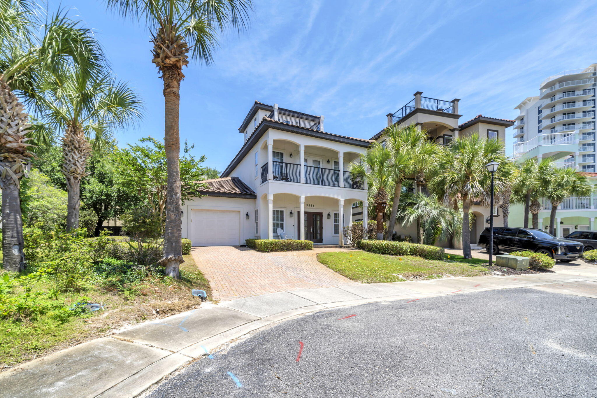 Coastal Mediterranean Villa Style home located within a Gated, Beach Front Community in Destin. The wood tile floors, exposed beams and stone counter tops add warmth and sophistication to the living, kitchen and bathroom areas. Inspired to entertain the living area is open with a lot of tall windows providing natural light. The large 3rd floor balcony offers spectacular views toward the lake and beach. The spacious master suite features a private balcony and is nicely updated with Granite and travertine stone in the master bath. The Dunes of Destin residents enjoy 600 ft. of deeded beachfront, a community pool, fresh water lake with fountains and walkovers. Ideal location and lifestyle for full time living or a vacation home!