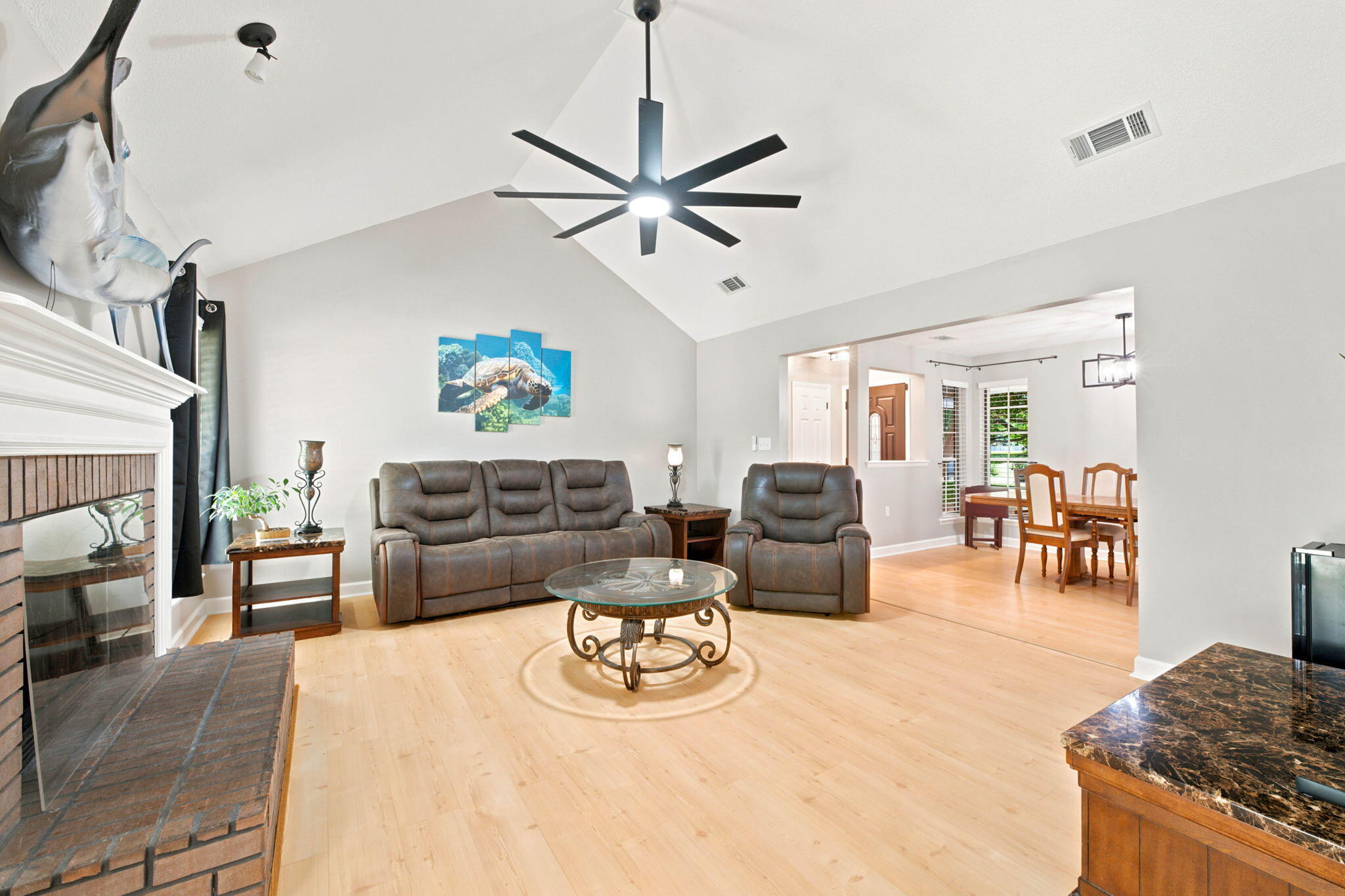 Tucked away on a quiet cul-de-sac in desirable East Navarre, this beautifully maintained brick home offers one of the most convenient locations in the area. Situated near the Santa Rosa County line, it's one of the first neighborhoods you'll reach coming home from Hurlburt Field while still being just minutes from top-rated Navarre schools, shopping, dining, and the sugar-white beaches of the Emerald Coast. The spacious living room features soaring vaulted ceilings and a cozy wood-burning fireplace, creating a warm and inviting place to gather. The kitchen is well appointed with white cabinetry, granite countertops, and stainless steel appliances. The primary suite offers plenty of space along with double vanities and a large walk-in closet. Outside, you'll find a fully fenced backyard shaded by mature oak trees with plenty of room to relax, play, or entertain. If you've been looking for a home that's been exceptionally well cared for in a fantastic location, this one deserves a look. Schedule your showing today!