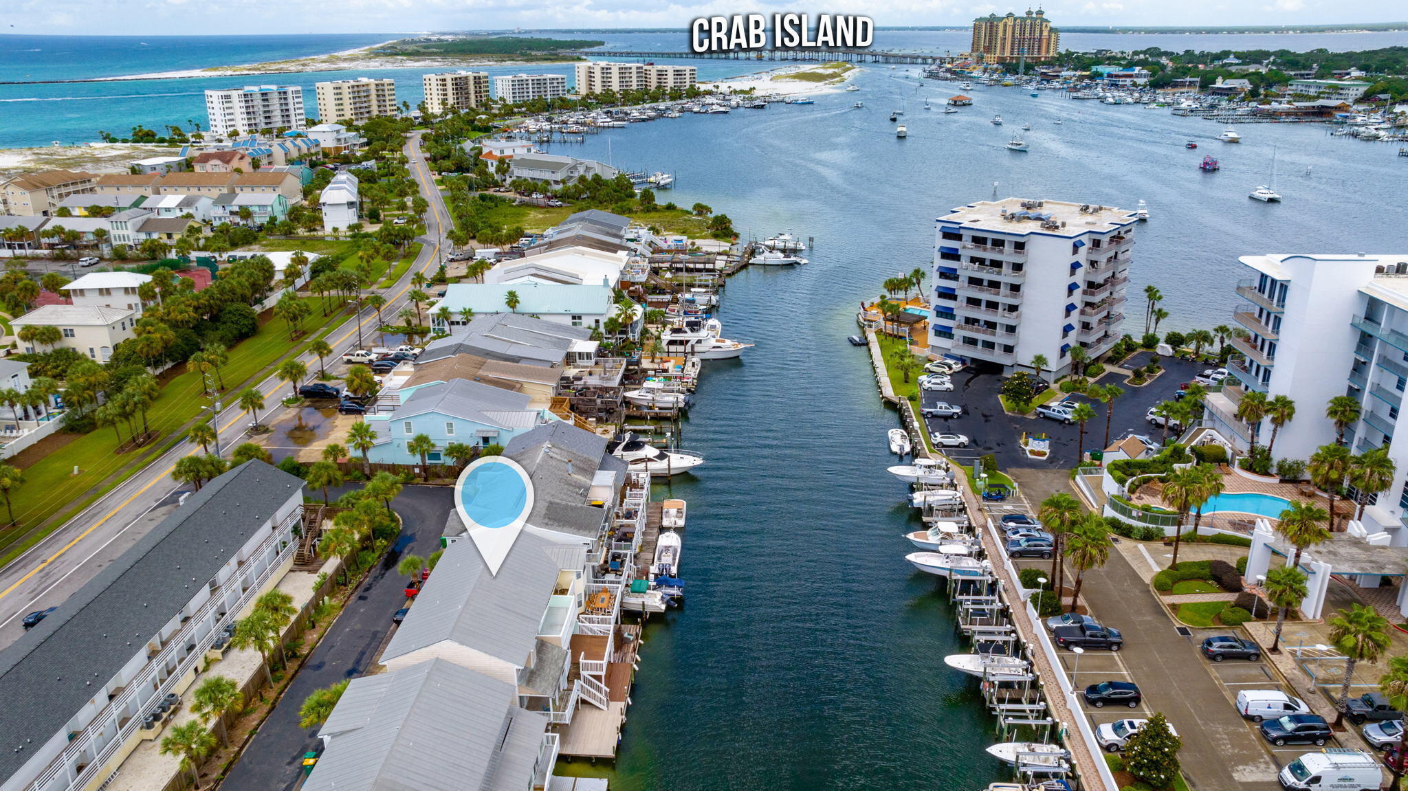 Waterfront Living with No building HOA! Holiday Isle HOA is $445 yearly. Don't miss this rare opportunity to own a canal-front townhome in a fantastic location with beautiful views of the Destin Harbor. Whether you're a boating enthusiast looking for your own private dock or an investor seeking a high-performing vacation rental, this property checks all the boxes. Short-term rentals are permitted, offering excellent income potential.

Relax and take in the waterfront lifestyle from one of two spacious decks or the upstairs balcony--perfect for morning coffee, sunset cocktails, or entertaining family and friends. Cast a line right from your deck, launch your boat from your private dock, and cruise over to Crab Island in minutes.

Inside, you'll find beautiful bamboo flooring throughout the bedrooms and tile flooring in the main living and dining areas. The stackable washer and dryer are conveniently located on the same level as the bedrooms. A downstairs half bath, not included in the listed square footage, provides added convenience with easy access from the lower deck after a day on the water.

Whether you're searching for a primary residence, vacation getaway, or investment property, this waterfront gem offers the perfect combination of location, lifestyle, and opportunity.
