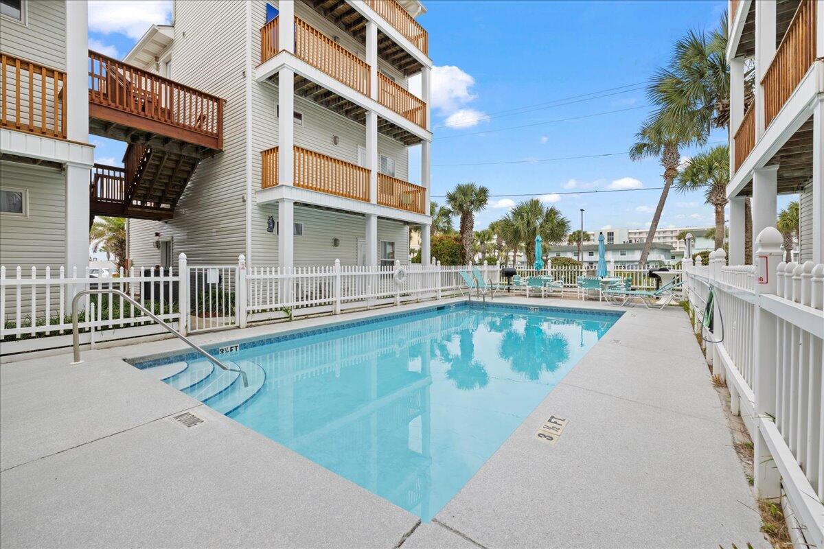 Welcome to Sunset Cottages 5A, a ground floor condo located on Okaloosa Island in the Florida Panhandle. This complex sits on the beach side of the road and is 150 feet from the public beach access. There may not be gulf views but at this price its the best opportunity to be at the beach without the gulf front sticker price. The building is very low density so no over crowded pool or parking lot. There is a community pool centered between all of the buildings with very easy access. The interior of the condo is an open floor plan, with the living room, dining room and kitchen combined in a large area surrounded by windows and natural light. The bedroom is large and has its own private entrance. There are bunks in the hallway to sleep two additional guest and a bathroom that has access from the bedroom and hallway. This home is sold completely furnished and is a rental machine. Gross rental income has increased year over year starting with 2024--$27,700, 2025-- $32,568 and now in 2026 the unit has done $11,536 up until 5/17/26 and currently has $20,000 on the books for the rest of 2026. HOA is under $800 a month.