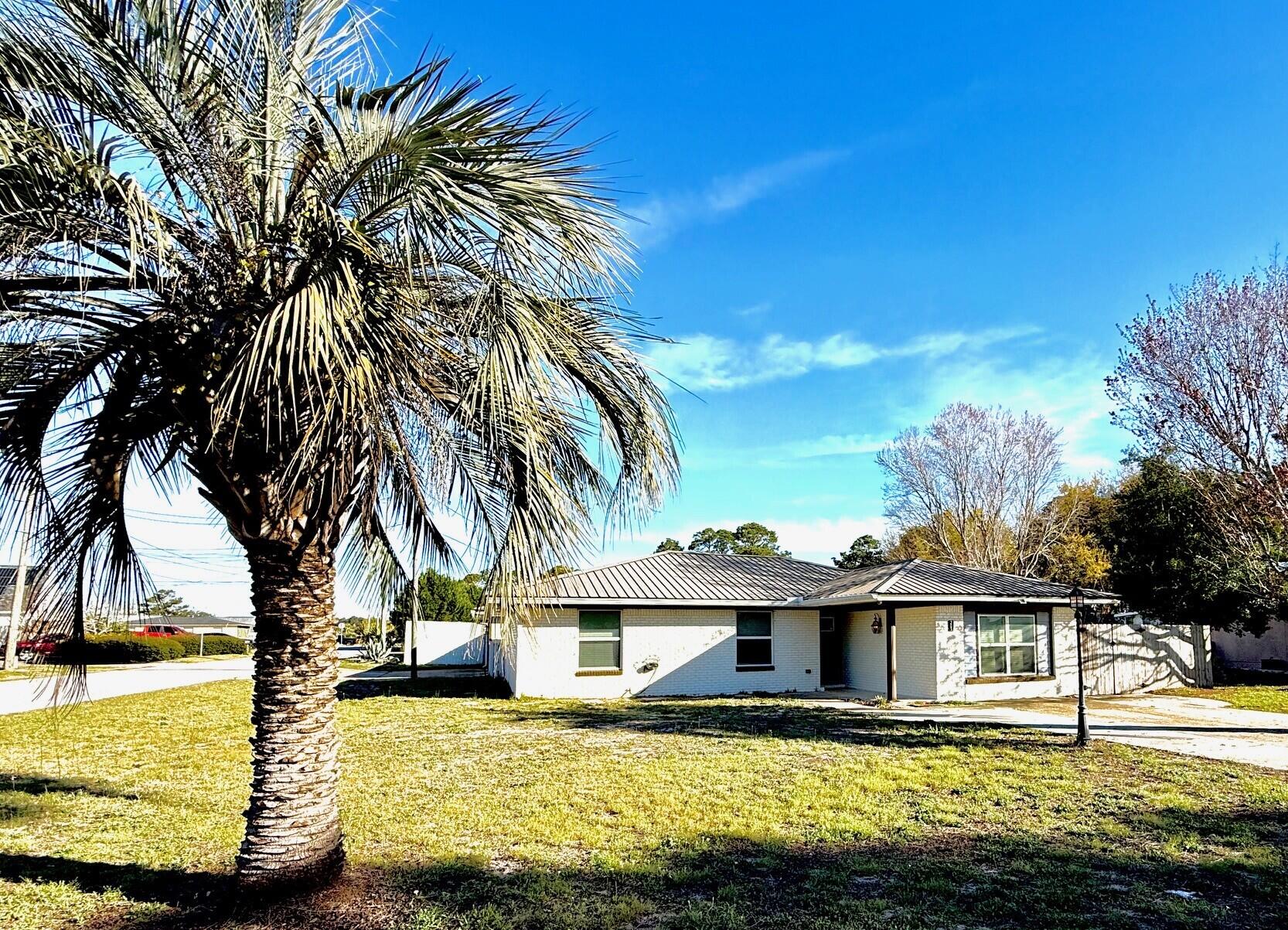 JUST REDUCED AND SELLER IS OFFERING $5000 INCENTIVE TO BUYER AT CLOSING WITH AN ACCEPTABLE OFFER! Spacious Panama City Beach Home with Private Entrance Mother-In-Law Suite/Apartment - just minutes to the Beach and the new Tallahassee Memorial Hospital! 

Centrally located in the heart of Panama City Beach, this inviting home offers flexible living space, thoughtful updates, and outdoor features designed for everyday enjoyment. Just 1/8 mile to the beach, five minutes to the new hospital, ten minutes to Pier Park and just 20 minutes to the International Airport, the home is also nestled in a neighborhood known for its great location to shopping, dining, neighbors, nearby park, and festive seasonal decorations that make it especially enjoyable for families.

A standout feature  is the private attached mother-in-law suite, offering a bedroom, private bathroom, huge walk-in closet, and additional living/bonus space. This layout provides excellent flexibility for extended family, guests, a private workspace, or a quiet retreat. A centrally located home office, craft room/bonus room adds even more versatility.

The main home features an open floor plan with granite countertops, updated cabinetry, Luxury Vinyl Plank and tile flooring, all completed during the 2017 renovation. Additional updates include new garage doors and a metal roof replaced in 2017. 

Important system updates include two separate AC units (front and back zones), with duct work added to the mother-in-law suite/apartment. Units were replaced in 2017 and 2018. Interior updates in 2017 also included tubs, tile, carpet, and the mother-in-law suite/apartment bathroom.

Outdoor features add even more appeal with a pergola-covered area perfect for relaxing or entertaining, added backyard sidewalks, a widened driveway, and a privacy fence installed in 2022. The property also includes a two-car garage and wiring already installed for security cameras (just add your own hard drive).

This home has been well loved and well lived in, filled with years of family memories. Even more reassuring for buyers in the area, the property has experienced no flooding and no homeowner's insurance claims.

This is a phenomenal property with so many options! It can be a primary residence with an income producing apartment or short-term rental, especially with the new hospital so close and the bonus room/office space could allow you to work from home! There are endless possibilities! Don't miss this opportunity!