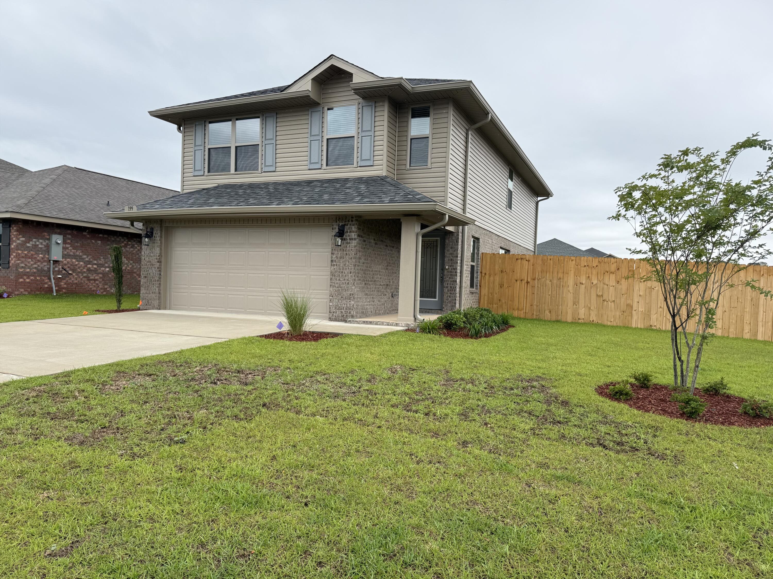Beautiful 4-bedroom home in North Crestview! This 1,817 sq ft two-story home offers 4 bedrooms and 2.5 bathrooms, with all bedrooms conveniently located upstairs. The exterior features durable 4-sided brick and a fully finished 2-car automatic garage. Inside you'll find upgraded PureTech LVP flooring throughout the main living areas, with carpet only in the bedrooms and stairs. The kitchen and bathrooms feature granite or quartz countertops for a modern touch. Outside, enjoy a fully sodded yard with an irrigation system and professional landscaping. Neighborhood amenities include a community pool, sidewalks, and streetlights - perfect for family living! Fence, Blinds, Gutters, Fridge, Washer/Dryer ALL included and in the home.