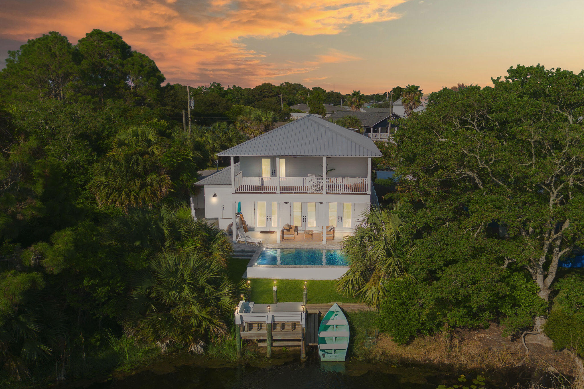 A newly renovated two-story home in the quiet Laguna Beach area of Panama City Beach, two minutes' walk from the white sand. Four bedrooms, three baths, a brand-new private pool, and a private dock on the freshwater lake behind the house. Two blocks to multiple public beach access points.
The home is primarily used as a personal residence yet generating approximately $71,000 in gross rental revenue in roughly 90 days of summer rentals.  For a buyer who wants a Gulf Coast property with proven income potential, the opportunity is both substantial and documented.
