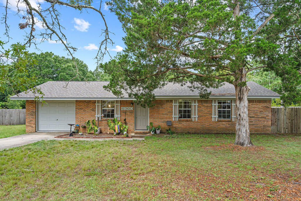 Looking for a move-in ready home with room to spread out? This charming 3-bedroom, 2-bath home offers the perfect combination of modern updates and a generous .84-acre lot in the heart of Crestview. Inside, you'll find an updated interior with thoughtful improvements throughout, including beautiful kitchen cabinetry installed in 2021. Major systems have already been taken care of with a new roof (2022), water heater (2022), and a complete electrical rewire (2022), giving the next owner added peace of mind.

Step outside and discover the true standout feature of the expansive, cleared, and level backyard, ready to fit your lifestyle. Whether you're dreaming of a garden, fluffy or fuzzy friends, a workshop, play space, or simply enjoying the extra room to roam, this property offers the flexibility to make it your own. There's even a custom catio that can remain with the home for your feline family members.

With approximately 1,075 square feet of thoughtfully updated living space, this home is an ideal option for first-time buyers, those looking to downsize without sacrificing outdoor space, or anyone searching for a property that's ready to enjoy from day one. Conveniently located in central Crestview with easy access to shopping, schools, dining, and everyday amenities, this is one you won't want to miss.