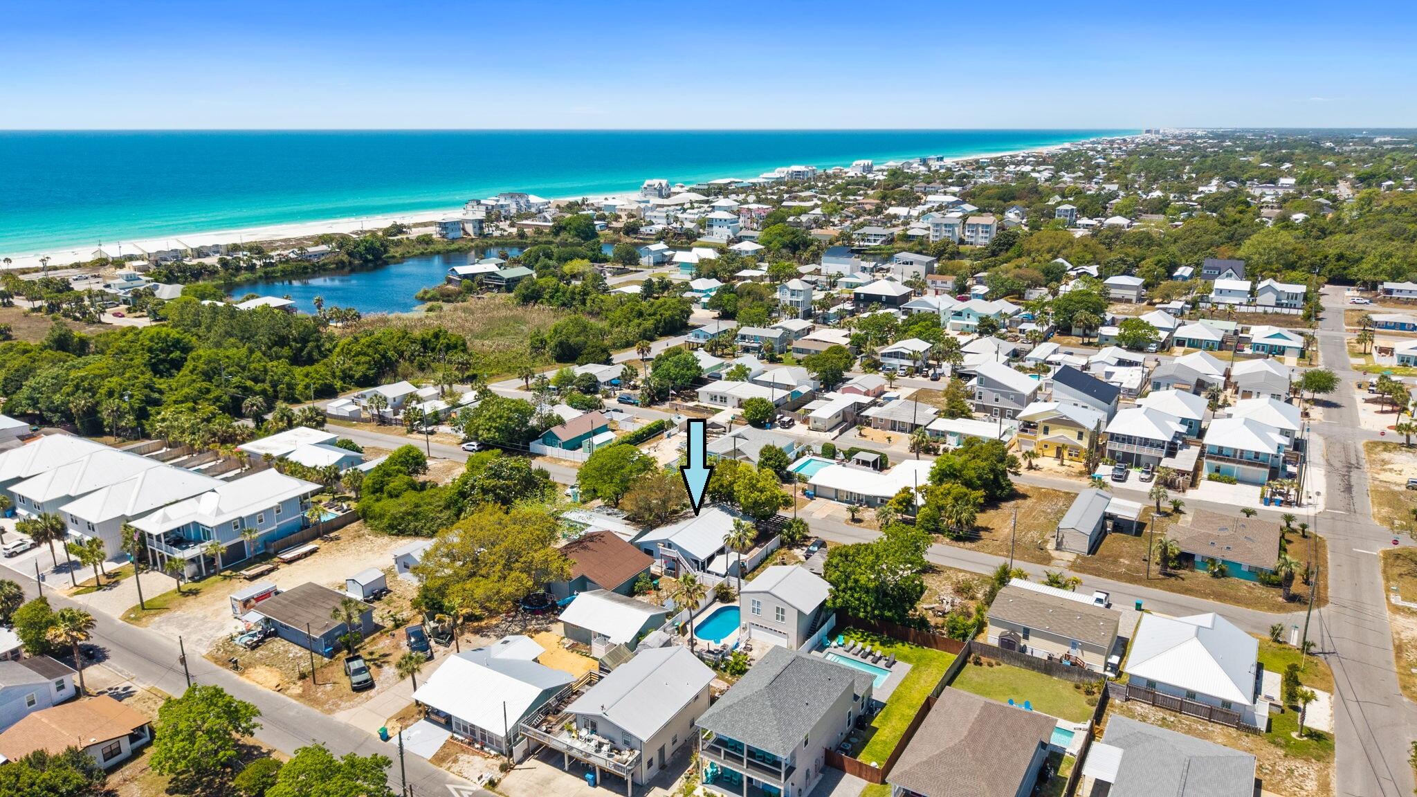 Turn-key beach house just 2 blocks from the Gulf on the highly sought-after West End of PCB, just off 30A! This fully furnished 4BR/2.5BA home is rental-ready and already producing $32K in 2025 from just peak months, used for personal use 9 months of the year, huge upside as a full-time rental. Open-concept layout with 3 bedrooms and 2 baths on the main level, plus a loft with bunks, full bed, and half bath making the property perfect for large groups. Enjoy outdoor living on both sides with seating areas and a fire pit. Additional features include an AC-equipped storage shed, golf cart parking, new HVAC with added ductwork (2024), and a new metal roof (2023) for lower maintenance and insurance. Ideal as an income-producing investment or personal beach getaway, start generating revenue immediately!