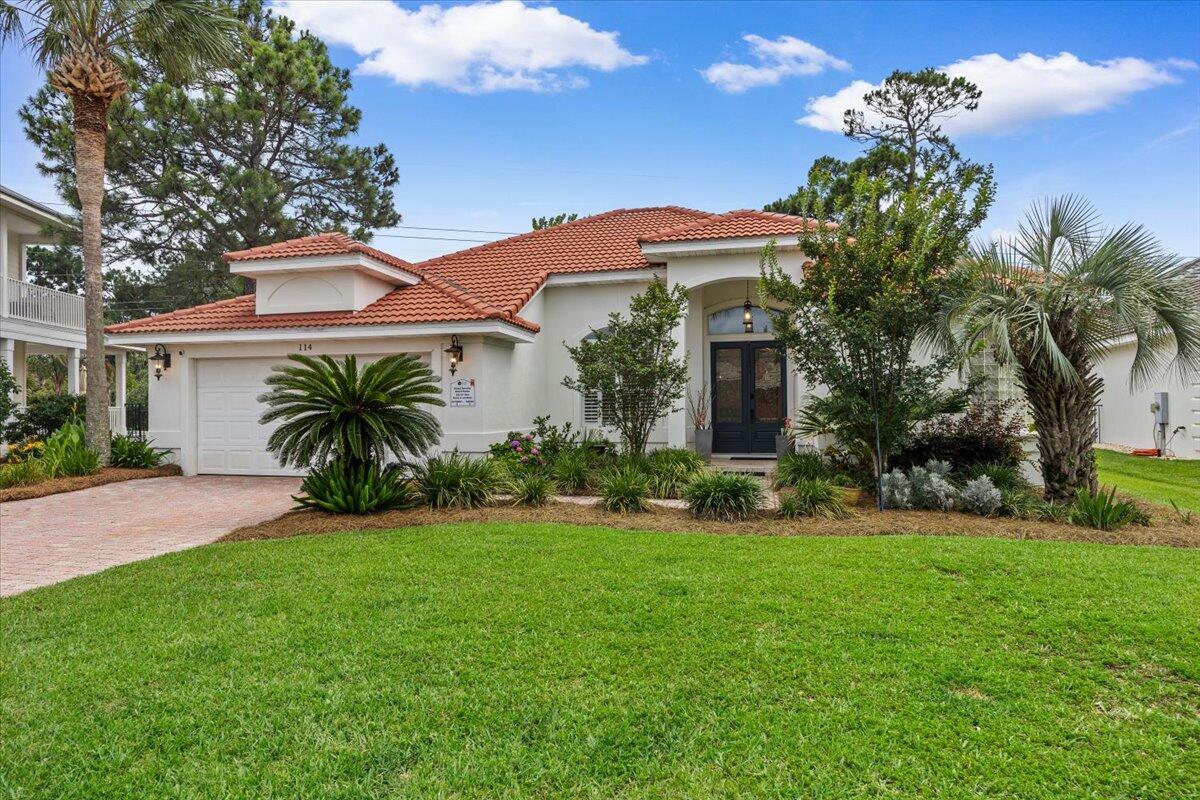Imagine waking up steps from the sugar-white sands and emerald Gulf waters with salty breezes and the sound of waves calling you outside. That's the lifestyle in Destiny East--a neighborhood nestled between Scenic Hwy 98 and U.S. 98, less than a 5-minute golf-cart ride (or a 10-minute stroll) to the beach. Club Destiny crowns the community with 2 tennis courts, a mini-theater, playground, and a resort-style pool complex that turns every day into vacation. Set on one of the largest lots in the neighborhood and no neighbors behind--this home backs to a peaceful path that winds to Lake Destiny. Inside, coastal elegance shines through a quartz-topped kitchen with high-end appliances, soaring 9- to 11-foot ceilings, and a double-sided fireplace. Owners are licensed Agents