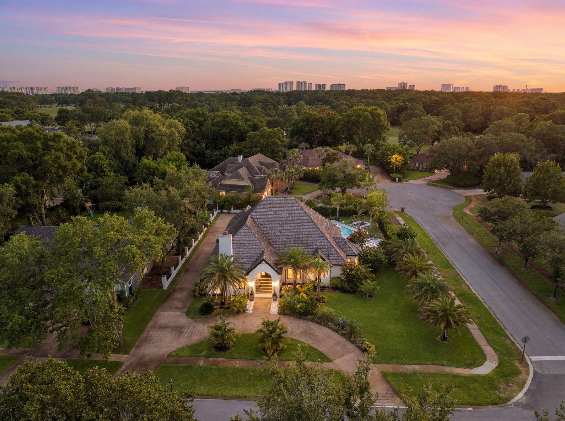 Situated on .43 acre corner lot, this single-story Indian Bayou estate is a true contemporary masterpiece that has been tastefully renovated with over $600k invested! The freshly painted brick, lush landscaping, inground pool, covered patio with retractable shades, and ample parking for everyone are sure to please. The moment you walk in, your eyes will be drawn to the seamless open floor plan with top-of-the-line finishes, smooth ceilings and intricate contemporary design elements: Stone inlay columns, 24'' Italian tile with wood accent flooring, custom light fixtures, wood burning/gas fireplaces, pop-out outlets, and more. The gourmet kitchen offers an oversized, seamless granite island, soft close custom cabinets, wine bar and Bosch 5 burner gas cooktop.