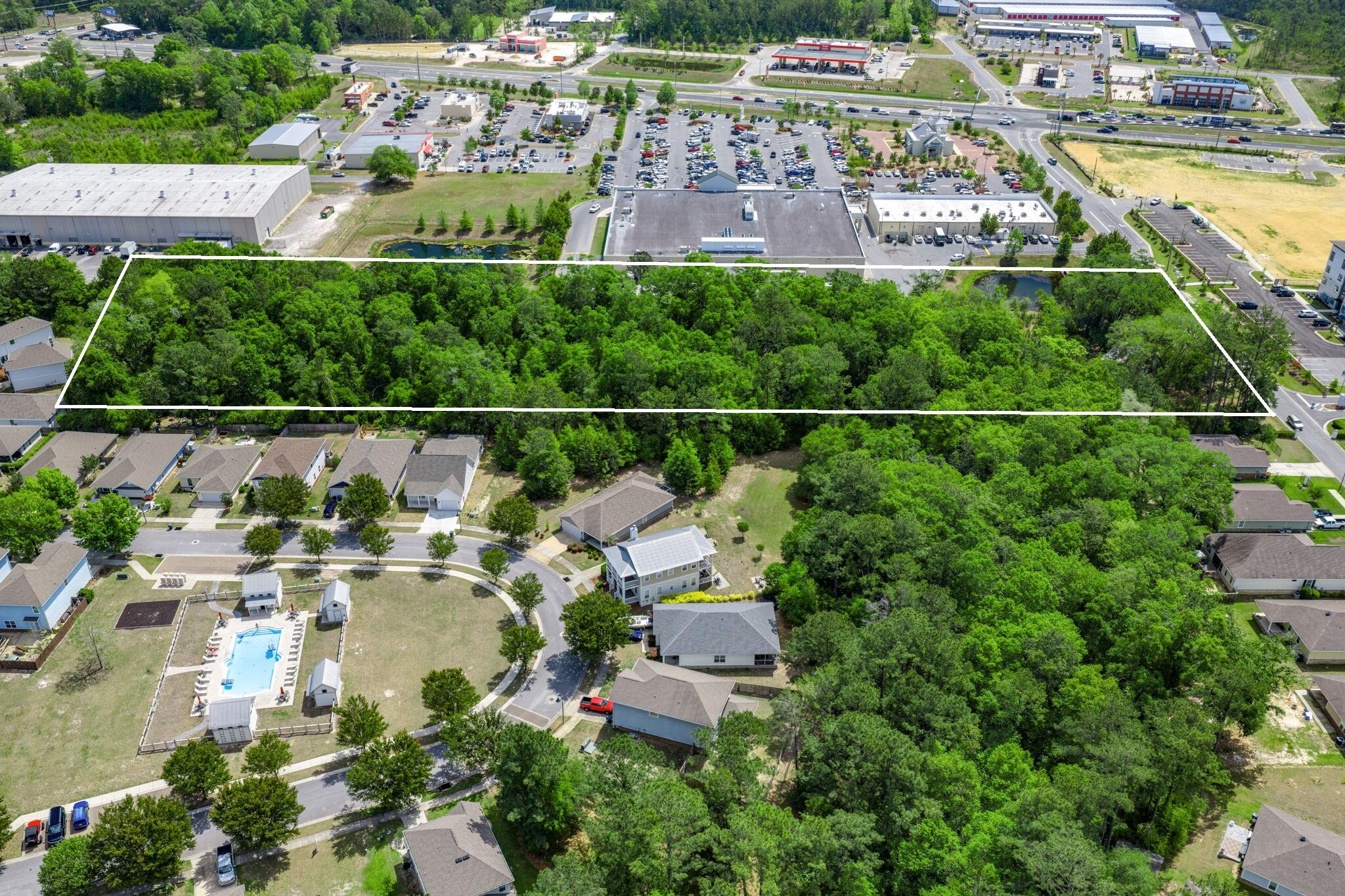 150 Marquis Way presents a rare 4.05-acre development opportunity in the heart of Freeport's explosive growth corridor. The property includes more than $475,000 in prepaid water capacity fees that transfer with the sale, offering immediate utility savings and development readiness. A current Development Order for a hotel provides flexibility for hospitality or mixed-use concepts. The site enjoys dual access from Marquis Way/311 and Highway 20 (Blue Ridge Parkway), with the Marquis connector extending west via bridge to Highway 83A South, ensuring strong regional connectivity.

This parcel sits amid major new development activity including Hammock Bay, a 3,000-acre master-planned community with thousands of existing homes and continuous residential expansion, anchors the population growth driving commercial demand along the Hwy 20 corridor. Nearby Owls Head is emerging as a major mixed-use employment and commercial hub, positioned at the crossroads of Hwy 331 and Hwy 20 and supported by new retail and industrial development activity. Further amplifying long-term absorption, Carr Farms represents one of the most significant planned projects in Walton County, with projections of up to 21,000 new homes and roughly 10 million square feet of commercial space at full build-out. Together, these developments form the backbone of Freeport's rapid transformation and create sustained demand for lodging, retail, services, and commercial uses surrounding 150 Marquis Way.