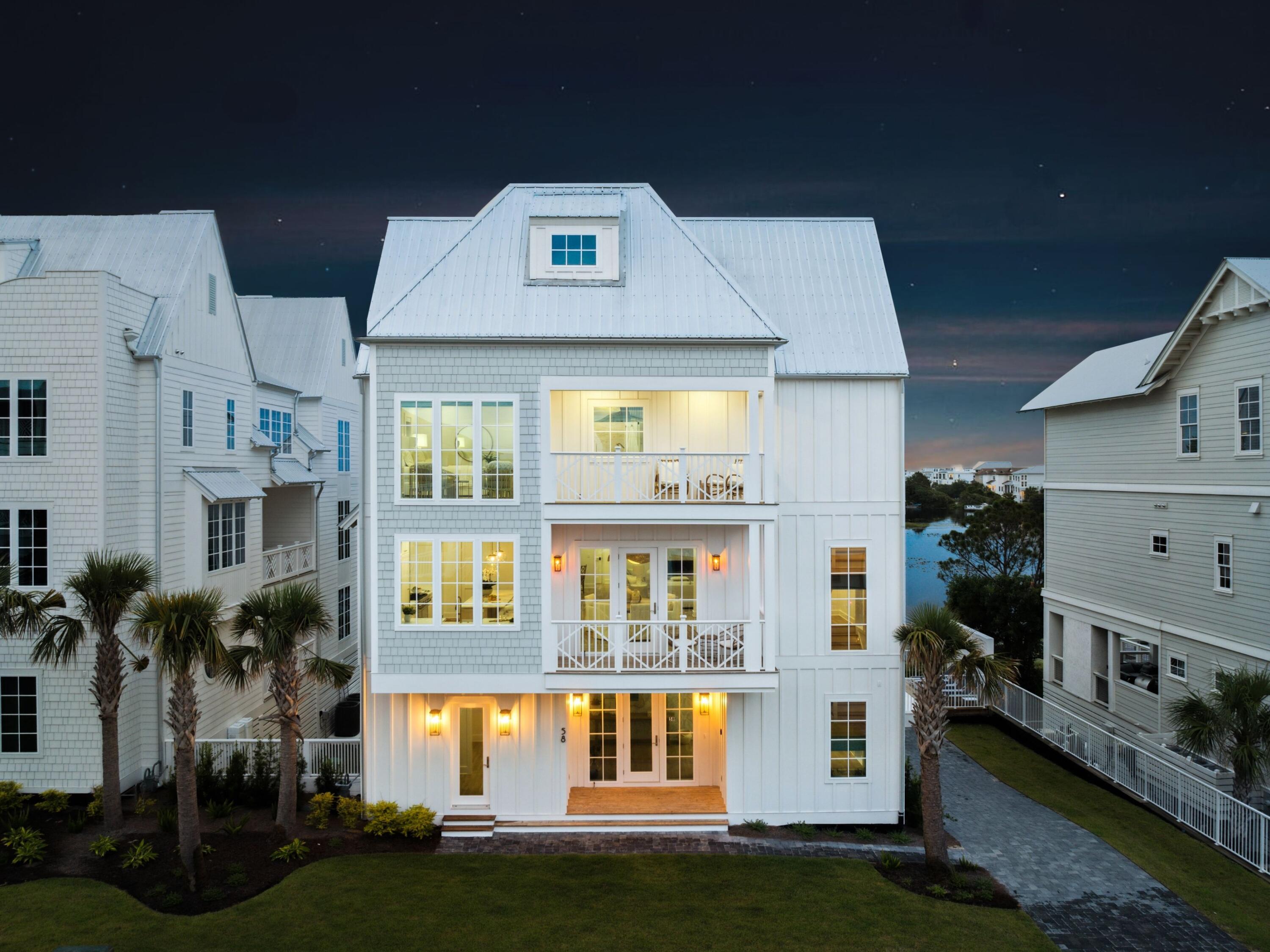 An extraordinary opportunity to own a premier residence on 30A, where tranquil Allen Lake lakefront living blends seamlessly with the ease of coastal convenience. Just a one-minute over to public beach access and steps from the celebrated 30A bike trail, this exceptional home sits on 74 feet of rare Allen Lake coastal dune lakefront--offering privacy, breathtaking water views, and a front-row seat to the natural beauty of the Emerald Coast. Enjoy peekaboo views of the golf course, adding yet another scenic element to this exceptional coastal retreat. Spanning more than 5,866 square feet, the residence features six generously sized bedrooms, seven full bathrooms, and two spacious bunk rooms, comfortably sleeping up to 20 guests, making it ideal for large family gatherings or exceptional vacation rental potential. Sun-drenched interiors are thoughtfully designed to balance refined elegance with relaxed coastal living, showcasing expansive gathering spaces, a gourmet kitchen crowned by a striking marble island, a fireside living room, and premium finishes throughout. A luxurious primary retreat features a spa-inspired ensuite bath with a freestanding soaking tub and glass-enclosed shower.

Step outside to a private pool where sunsets over the serene lake become a daily ritual, and morning coffee or evening gatherings unfold in the peace of your own backyard. Direct lake access invites kayaking and paddleboarding at leisure, while multiple covered balconies capture shimmering glimpses of the Gulf beyond. Nearby, iconic 30A communities, scenic trails, and beloved local dining offer endless ways to savor the coastal lifestyle.

Whether envisioned as a private family retreat or a forever home, 58 Woodward Drive delivers an unmatched union of luxury, location, and lifestyle--a rare offering on the Emerald Coast that promises a lifetime of memories.