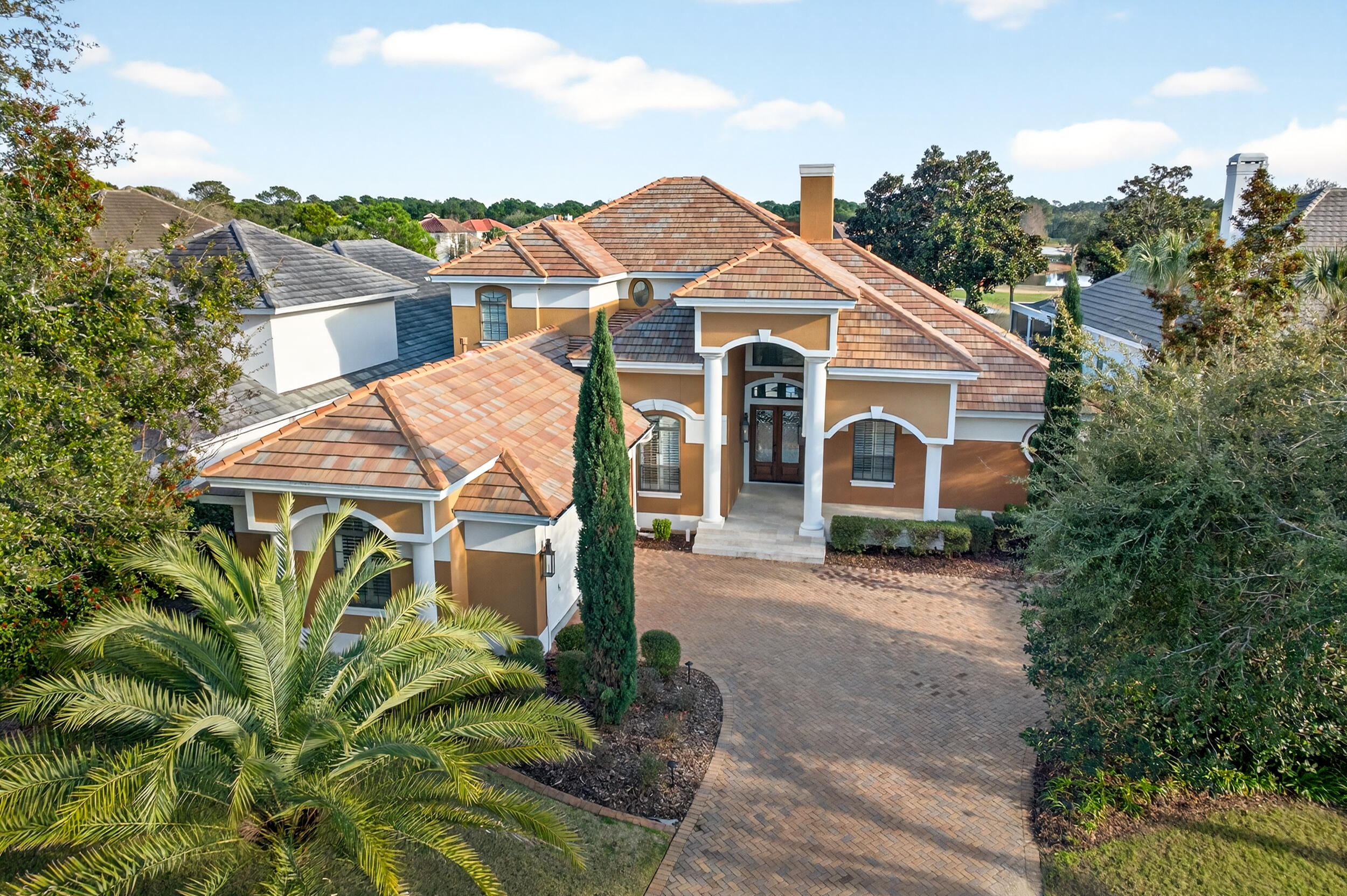 Luxury 4BR/4BA golf course home with lake views in the gated Regatta Bay community of Destin. Perfectly positioned along the 15th green of the award-winning 18-hole golf course, this private two-story residence features soaring 22-foot ceilings, a first-floor primary suite, dedicated office, remodeled heated pool and spa, outdoor kitchen, screened porch, and renovated climate-controlled 2-car plus golf cart garage.

The open-concept floor plan showcases wood flooring, crown molding, custom millwork, a dramatic 22-foot fireplace, quartz countertops, Wolf appliances, Sub-Zero refrigerator, and a luxurious primary suite with a spa-inspired bathroom, dual walk-in closets, and direct access to the pool area. Upstairs offers additional living space ideal for guests, a media room, or a second family room.

Just minutes from Destin's white-sand beaches, shopping, dining, and entertainment. Regatta Bay amenities include a marina, boat launch, waterfront access, fishing dock, clubhouse, resort-style pool, tennis courts, pickleball courts, playground, game room, and 24-hour gated security. Pet-friendly community. No short-term rentals allowed.