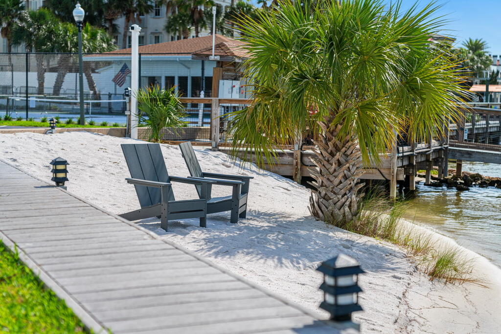 DON'T MISS OUT ON THIS UNIQUE OPPORTUNITY TO OWN THIS SPACIOUS HARBOR-FRONT PENTHOUSE located in one of Destin's most desirable waterfront communities on Holiday Isle! Welcome to Dolphin Point, a newly gated community for added security & privacy. This BEAUTIFUL PENTHOUSE is 3bed/2bath on the 7th floor NE corner w/AMAZING VIEWS of the Destin Harbor from every room & patio! Appointed w/ high ceilings, crown molding and natural light flowing throughout, makes it feel like home!  Sitting out on one of your patio's, sipping a cocktail in the evening with sky & sunset views, watching boats caressing by, creates the ultimate feeling of wholeness, peacefulness and relaxation. If you prefer to take a stroll on the beach, it's only a a short walk with a private entrance and access gate. Updates include new HVAC+ water heater 2024, along with new hurricane grade sliders. Current owners have invested 70K+ in these recent updates along with current improvements/upgrades to building and entire complex which is still in progress and includes- waterproofing walkways, corridors and patio's, new patio railing, all new hurricane windows and doors, newly designed clubhouse, pool house, and golf cart parking. Construction of ''C Building'' is coming to a close and should be finished soon just in time for summer! Don't wait on this one! Make it your dream home as your permanent residence, use it as your vacation home or create a great investment opportunity with rental income! It won't last long! Dolphin Point Condominiums offers an exceptional waterfront lifestyle with a variety of amenities for owners, residents and guest's to enjoy. The newly gated community features a tennis and pickleball court, barbecue grills, outdoor dining tables, and two private white-sand beach areas located on both sides of the harbor, complete with chairs for relaxing and enjoying the water views, sunrises, sunsets and boats passing by. The beautiful beach is down the street (approx. 5 minute walk) with a private access code and gate.  Golf-cart parking is allowed near the private entrance to Gulf for quick access, if you don't want to walk to the beach and is on a first come basis.   

Additional conveniences include docks located behind each building, a newly renovated waterfront clubhouse with an outdoor patio overlooking the harbor, and rental opportunities for golf cart storage, kayak storage, canoe storage, paddleboard storage, and boat slips when available. Boat slips periodically become available for purchase by owners and sometimes available for short term/long term rental.  

Residents enjoy easy access to boating, fishing, paddle sports, and waterfront recreation, all within a beautifully maintained community in the heart of Destin.