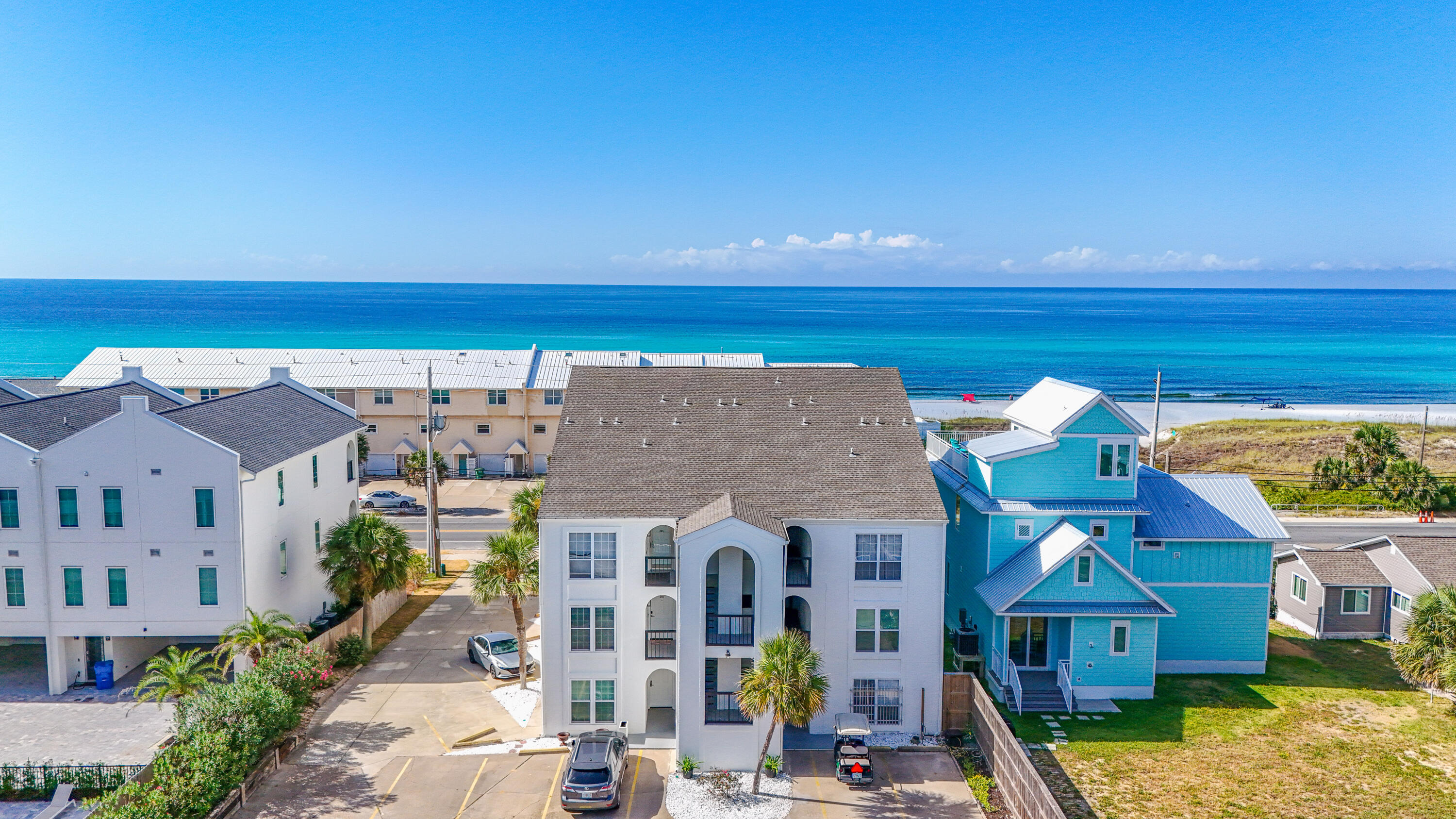 HUGH PRICE IMPROVEMENT!!!  ALMOST $15,000!!  Properties in Nautilus Condo seldom become available--this is a rare chance to own a slice of paradise with stunning sunrises and sunsets.  Enjoy coastal living at its best in this sought-after second-floor condo with sweeping, unobstructed beach views. This boutique building offers just nine residences, no short-term rentals, and direct access to a dedicated stretch of sand--creating a peaceful seaside retreat. The well-designed layout includes two bedrooms and two bathrooms in just under 800 square feet, ideal for full-time living or relaxing escapes. Expansive windows capture the shoreline and fill the home with Gulf views.