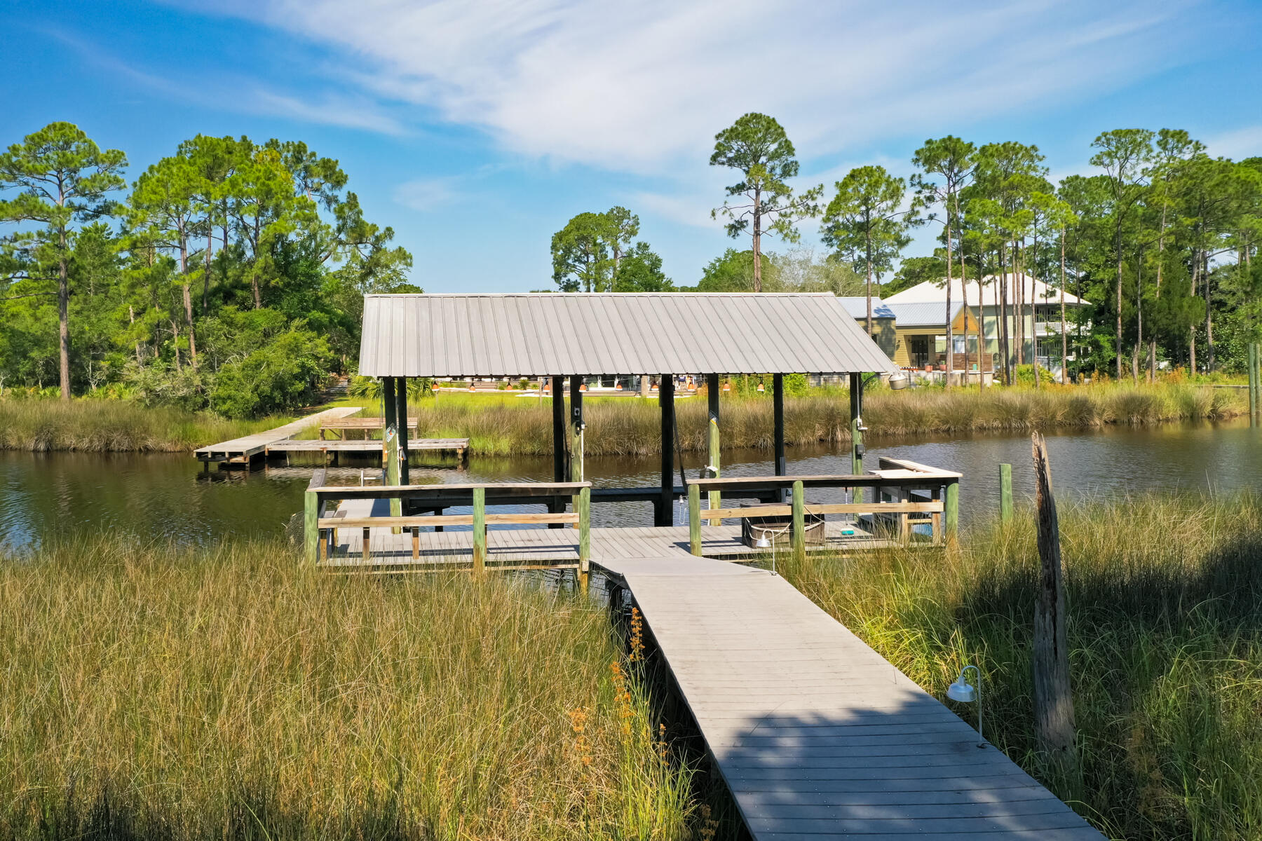 Discover your dream waterfront retreat at 95 Bluebell Cir, Santa Rosa Beach, FL! Nestled along the picturesque Mack Bayou, this exceptional property combines unmatched privacy with breathtaking water views. Set on a sprawling 0.43-acre lot boasting 86 feet of pristine waterfront, it's a true haven for boating enthusiasts. Step inside to find a newly renovated eat-in kitchen that's a masterpiece in both style and functionality. Outfitted with sleek stainless steel appliances, it's a space designed to inspire your inner chef. The open-concept layout effortlessly flows into the inviting living room, where floor-to-ceiling bayou views create a stunning backdrop for everyday living. All excisable by stairs or elevator. 
 Take the experience outdoors to the expansive covered porch--a tranquil setting perfect for morning coffees, sunset gatherings, or simply soaking in the serene beauty of your surroundings. This is more than a home; it's a lifestyle.