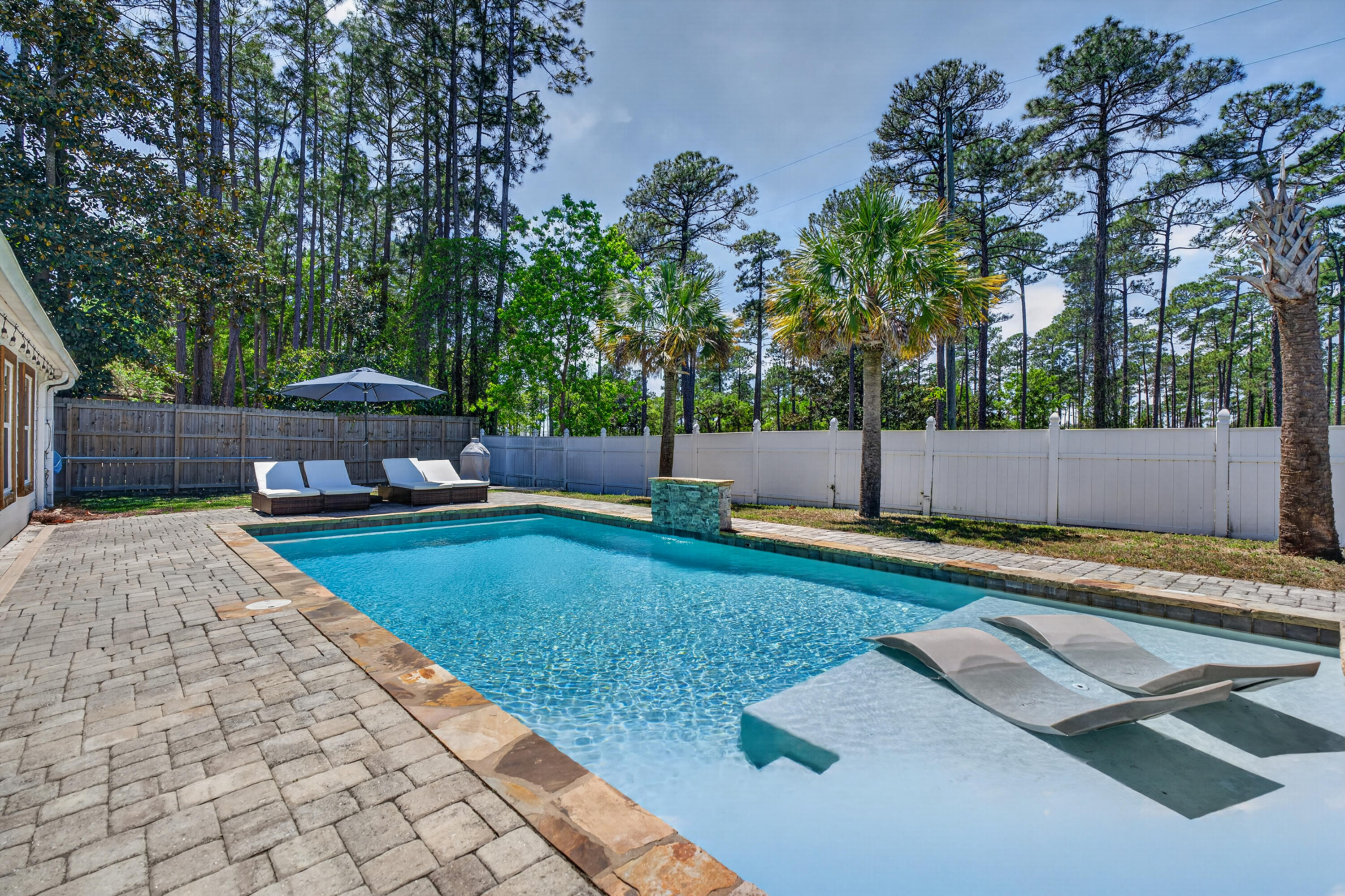 Discover the perfect blend of comfort, style, and location in this beautifully updated home situated on a spacious half-acre lot near the highly sought-after 30A corridor. Ideally positioned on a quiet cul-de-sac, this property offers a peaceful setting while remaining just minutes from the area's renowned white sand beaches, dining, and shopping. Step inside to a bright, inviting interior featuring an open and functional layout designed for both everyday living and entertaining. The well-appointed kitchen serves as the heart of the home, complete with new quartz countertops, new custom cabinetry, zellige backsplash new Zline appliances including a gas range, and generous prep space. Outdoor living is equally impressive. The private backyard showcases a sparkling pool and ample space to relax, entertain, or enjoy Florida's year-round sunshine. The expansive lot offers flexibility for outdoor activities, gardening, or simply enjoying the natural surroundings.  Residents also enjoy access to a nearby community lake--perfect for fishing, picnicking, or unwinding in a scenic setting. With its combination of location, lot size, and thoughtful features, this property presents an exceptional opportunity to experience the best of coastal living near 30A.