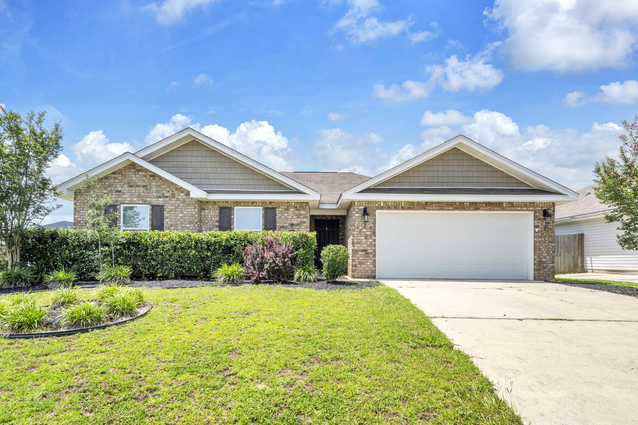 Available now! Spacious 3-bedroom, 2-bath home on an oversized corner lot with a fully fenced backyard conveniently located in south Crestview with easy access via Live Oak Church Road, allowing you to avoid much of Crestview's traffic while remaining close to Eglin AFB, Duke Field, and the 7th Special Forces Group. The home features a desirable split floor plan, durable luxury vinyl plank flooring throughout the common areas, and  carpet in the bedrooms. The kitchen is equipped with stainless steel appliances and a large center island, providing plenty of space for cooking and entertaining. The oversized primary suite boasts an enormous walk-in closet with enough room for both his and hers wardrobes, plus additional space that could be used for a small office or sitting area. The primary bathroom includes a garden tub, separate shower, and private water closet. A washer and dryer are also included for tenant use, if desired.