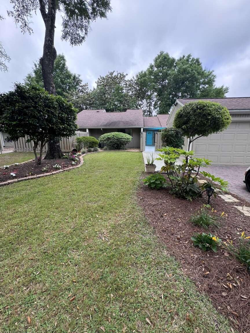 Live where convenience meets coastal charm, just 0.8 miles to Schooners Marina & Restaurant and 0.8 miles to Bluewater Bay Golf Course. This beautifully updated townhouse offers a low-maintenance lifestyle with thoughtful upgrades throughout, tucked into one of Niceville's most desirable communities near the bay. Inside you will find new LVP flooring, shiplap-accented bathrooms, and custom wood shelving in the pantry and hall closets. The kitchen features granite countertops, a gorgeous backsplash, under-cabinet lighting, a new garbage disposal in 2026, and a 2024 LG stove. A charming sunroom with exposed timber beams is ideal for a home office or cozy sitting area, while vaulted ceilings in the living room create an open, airy feel. The guest bedroom has a walk-in closet with custom shelving. The primary suite includes two custom his-and-her closets with barn doors and built-in lighting, plus an ensuite with large glass walk-in shower and extra storage. Enjoy a private patio with coastal mural. Sails, front patio TV, patio lighting, washer and dryer convey. Major systems: roof 2016 (HOA replaces every 15 years), A/C 2020, water heater 2019, gutters 2021, and ductwork cleaned 2025. Additional perks include electric landscape lighting, four Ring cameras, a one-car garage with extra storage, and epoxy-finished concrete patios. HOA maintains everything outside the courtyards. Bluewater Bay offers access to pool, tennis and pickleball through optional membership program. Welcome to your new walking and golf cart community!
