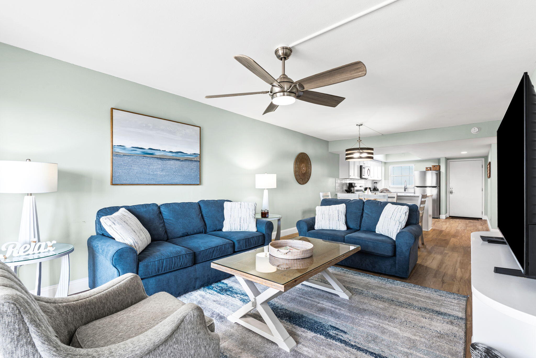 Welcome to effortless coastal living with stunning water views from the 5th floor. This beautifully updated condo offers a front-row seat to breathtaking sunsets, with a private balcony overlooking the serene sound - perfect for relaxing and watching boats pass by. Set within a well-maintained 13-acre beachfront community, residents enjoy an exceptional range of amenities including two pools (one heated and one beachfront), a full fitness center, sauna, spa, tennis courts, gazebo, 24-hour security, and community spaces for gatherings, along with a variety of activities. The unit has been thoughtfully renovated in 2025 with stylish, modern upgrades throughout, including a brand-new kitchen with granite countertops, all new appliances, Lifeproof flooring, updated lighting, and new doors. Both bathrooms feature new vanities with granite tops and upgraded fixtures. Additional improvements include a new water heater, all new furniture, and updated window treatments with blinds and curtains. A perfect blend of comfort, style, and coastal charm. Welcome to your own piece of paradise!