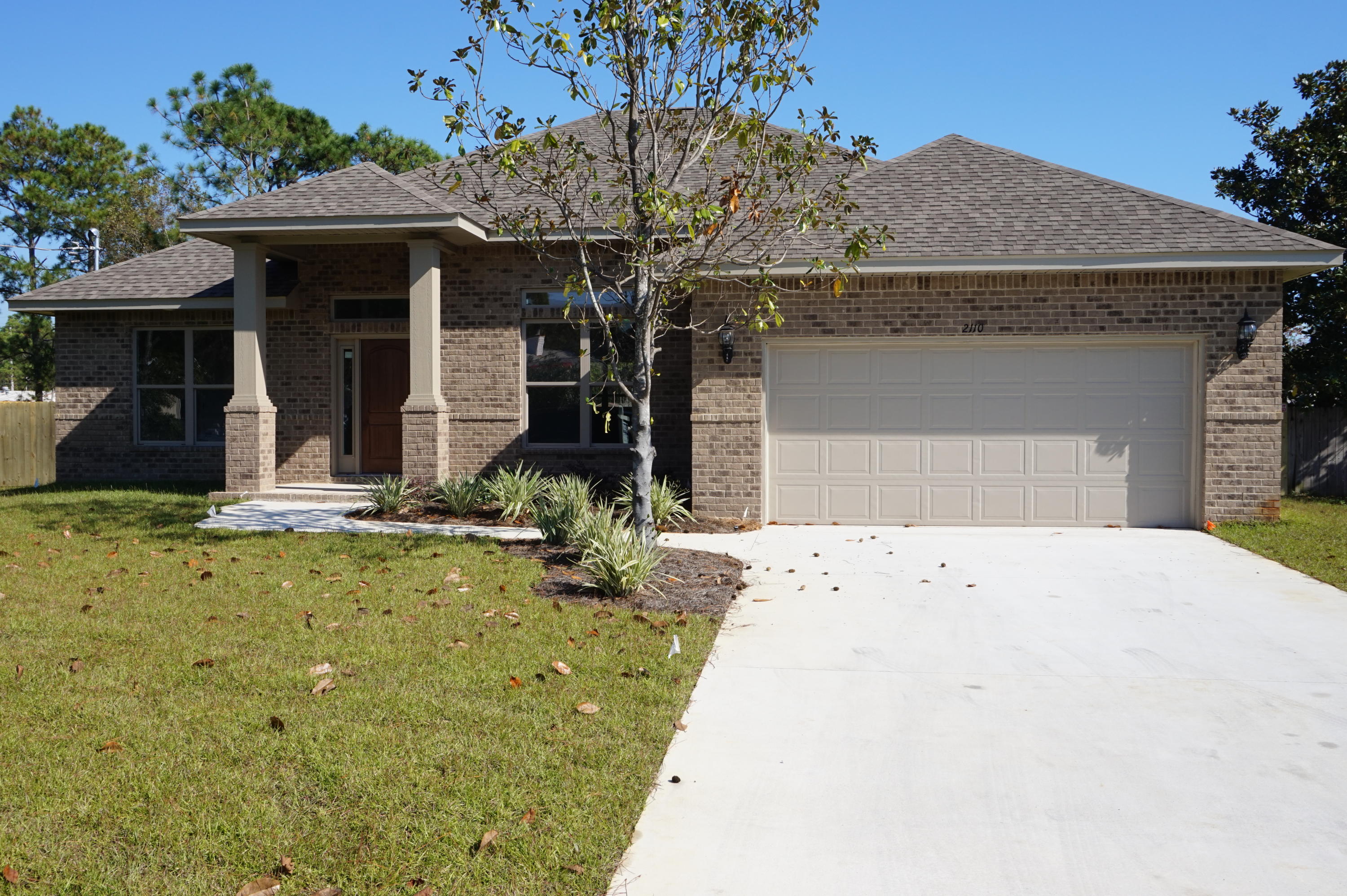 NEW CONSTRUCTION in Central Navarre~Luxurious 3 bedroom / 2 bath split floor plan will be completed in late Jan...Wonderful curb appeal and within easy access to the Waterfront Navarre Park and access to the Santa Rosa Sound and Sugar White Beaches~All brick exterior with accent craftsman columns and covered back porch. Impressive inside and out with custom attention to detail Soaring ceilings in the main living area. Large kitchen with staggered cabinets, crown, under mount sink, S/S appliances and beautiful 3cm granite countertops wrap around hop up bar with open flow to the Great room with French doors out to the covered back porch to have a complete outdoor living space to sit and enjoy those wonderful Florida evenings. Gorgeous Wood Plank Tile in the main living area /foyer /kitchen and all wet areas. Trey ceiling and crown molding in the Master ~custom walk in 5 ft. tiled shower with granite double vanity and antique bronze fittings. Additional bedrooms are carpeted, good size rooms with large closets and ceiling fans, separate laundry room ,over sized double garage with 8 ft garage door ,front and back covered porch are a few of the features of this home. Situated on a large lot with grassed yard~Well and irrigation system for easy maintenance in the summer months, Central location offers easy access onto Hwy 98 and close to the Navarre Beach Bridge and local stores, short driving distance to Hurlburt. PICTURES ARE OF A SIMILAR HOME AND COLORS MAY VARY.
