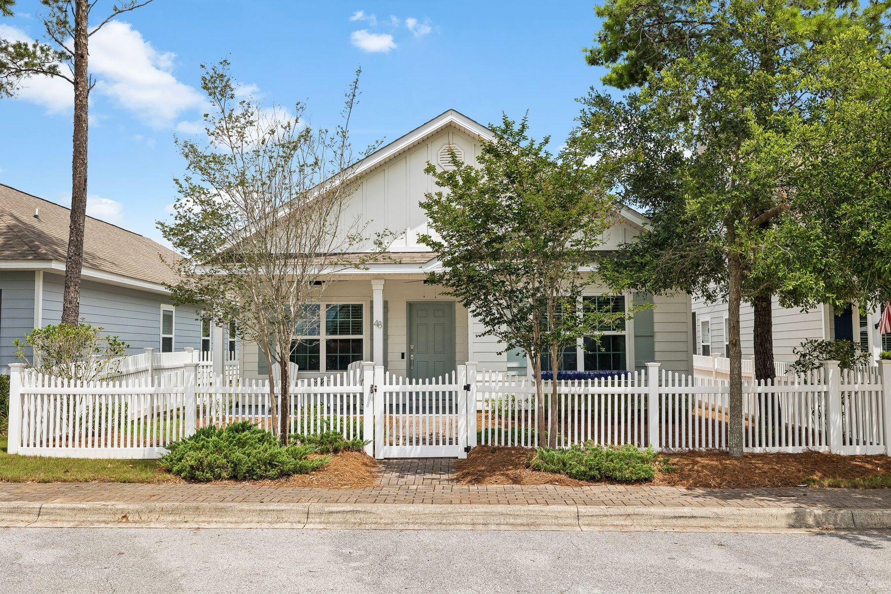 Positioned directly across from Hammock Bay's premier amenity center, this beautifully updated single-level residence offers an exceptional opportunity to enjoy a carefree lifestyle in one of northwest Florida's most sought-after master-planned communities. Thoughtfully renovated and meticulously maintained by its original owner, the home combines modern finishes, everyday convenience and low-maintenance living just steps from the neighborhood's most popular attractions. Inside, a bright open floor plan is enhanced by updated luxury vinyl plank flooring throughout, fresh interior paint, custom lighting and a fully reimagined kitchen featuring luxury cabinetry, upgraded countertops, backsplash and upgraded stainless-steel appliances. The spacious island anchors the living and dining areas, creating a natural gathering space for entertaining and everyday living. Both bathrooms have been refreshed with updated cabinetry and countertops, while the absence of carpet throughout the home offers both style and practicality.

The thoughtfully designed Porter floor plan includes three bedrooms, two bathrooms and a two-car garage, providing comfortable single-level living that appeals to a wide range of buyers. The primary suite features a spacious bath with a separate soaking tub and walk-in shower, creating a relaxing retreat at the end of the day.

One of the property's most compelling advantages is its location. Residents can walk to the fitness center, resort-style pools, pickleball and tennis courts, basketball courts, the General Store and Props Brewery, making it easy to enjoy the community's extensive amenities without ever getting in the car. A fenced front yard adds additional privacy, while the HOA-maintained landscaping allows owners to spend less time on yard work and more time enjoying the lifestyle.

Monthly HOA dues include access to three pools, a 24-hour fitness center, clubhouse, movie theater, tennis and basketball courts, playgrounds and the Bay Club, complete with a fishing pier overlooking Choctawhatchee Bay. Lawn maintenance, fertilization, irrigation and mulching are also included, creating a truly lock-and-leave ownership experience.

Whether you're searching for a primary residence, a second home or a place to enjoy your retirement years, this move-in-ready home offers the comfort of newer construction, extensive recent upgrades and an unmatched location at the heart of the community.