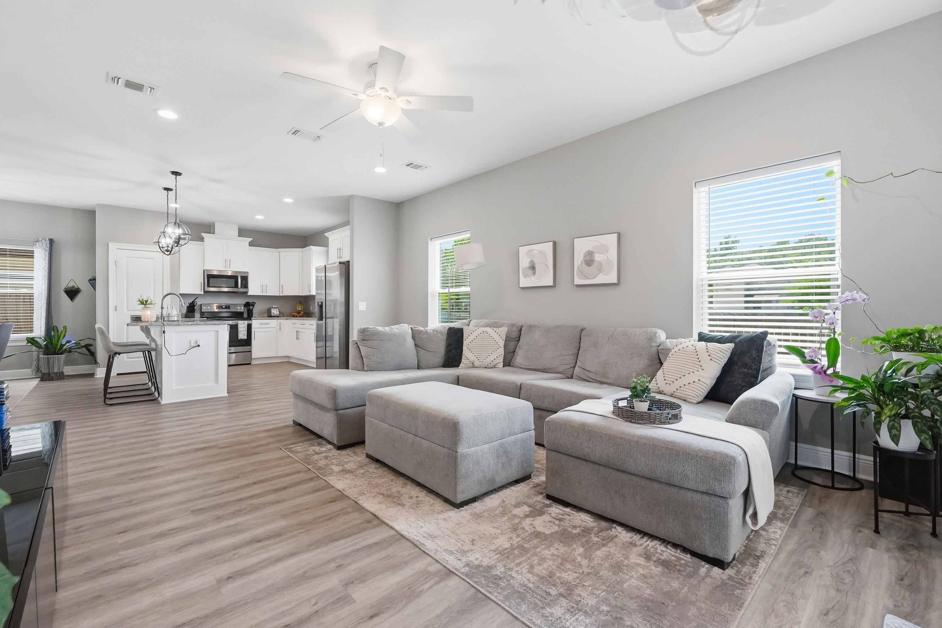 Welcome to 2331 Hadleigh Hills Court! Built in 2022 by Robbins Builders, this move-in ready 4-bedroom, 2.5-bath home offers two spacious living areas, a privacy-fenced backyard with no direct rear neighbors, an EV charger, and a hot tub that conveys--all just minutes from Navarre Beach, Hurlburt Field, shopping, dining, parks, and Highway 98.Inside, the open-concept layout creates a seamless flow between the kitchen and living spaces, making everyday living and entertaining feel effortless. Large windows fill the home with natural light, creating a bright and welcoming atmosphere throughout.
The kitchen serves as the heart of the home and features white shaker cabinetry with crown molding, granite countertops, stainless steel appliances, an undermount sink, and a large center island with bar seating and additional prep space. Luxury vinyl plank flooring runs throughout the home, offering durability, easy maintenance, and a clean, modern look. The primary suite provides a relaxing retreat with dual granite vanities, undermount sinks, and an oversized tiled shower. Three additional bedrooms offer flexibility for guests, a home office, hobbies, or growing households.
Outside the covered back patio overlooking a peaceful backyard with no direct rear neighbors, creating a private setting to relax, entertain, or enjoy the included hot tub.
Additional features include a built-in hurricane shutter system with custom fabric shields and for peace of mind. Designed with both comfort and functionality in mind, this home offers thoughtful upgrades, modern conveniences, and a location that puts you just minutes from everything that makes the Emerald Coast lifestyle so desirable.
