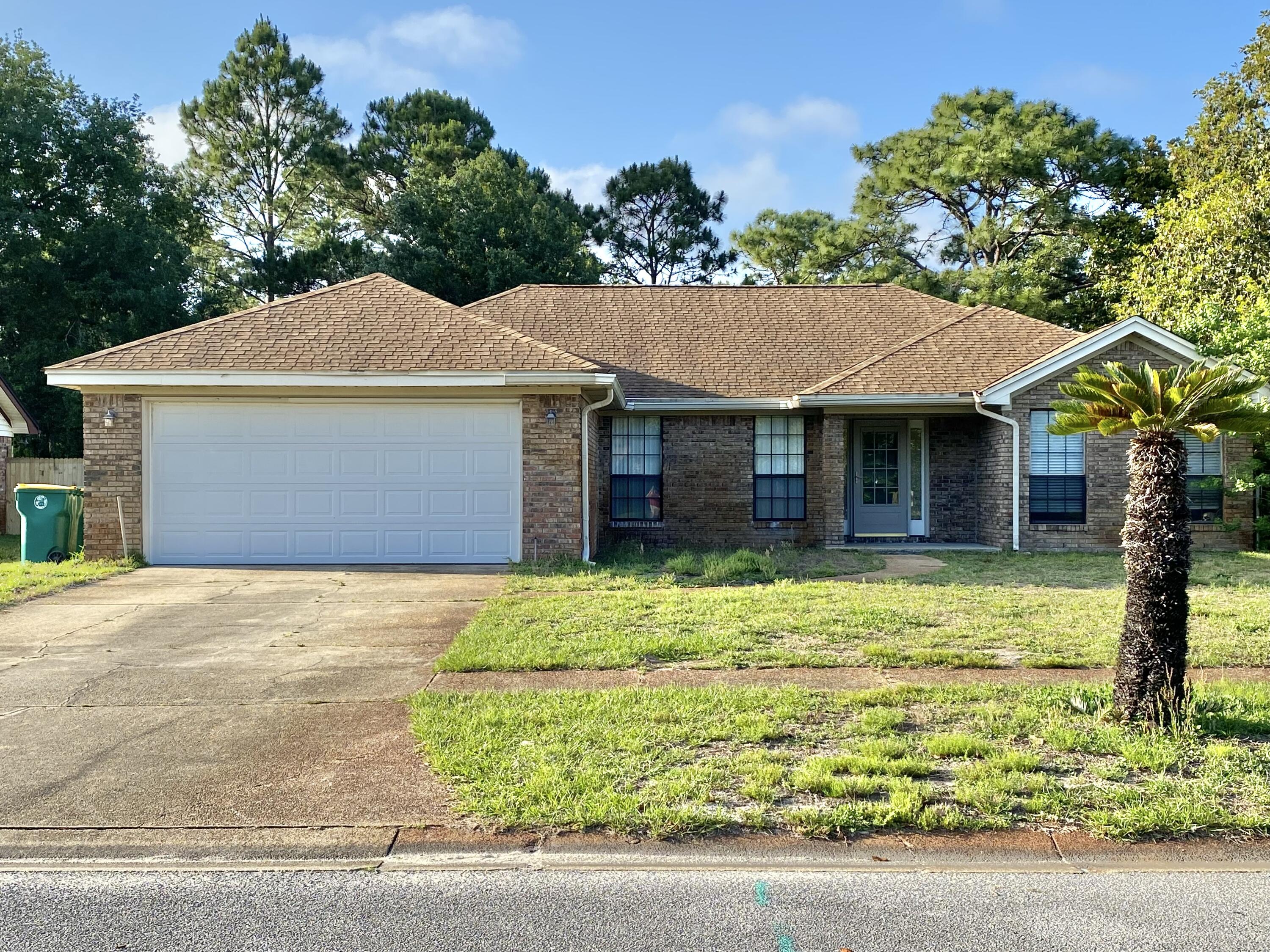 Welcome home! This lovely brick home is close to bases, beaches, shopping, and more. Enjoy your quiet retreat at this home that backs up to the base while sitting in your own Florida room. This well-maintained home features a kitchen island with a breakfast bar for getting ready for your day or just relaxing with friends. Freshly painted! Enjoy the fireplace, the spacious bedrooms, skylight, new fixtures, fully fenced backyard, and more. Ready for you to move in now! Buyer and Buyers agent to verify all dimensions and anything deemed important. Lawn Maintenance coming soon!