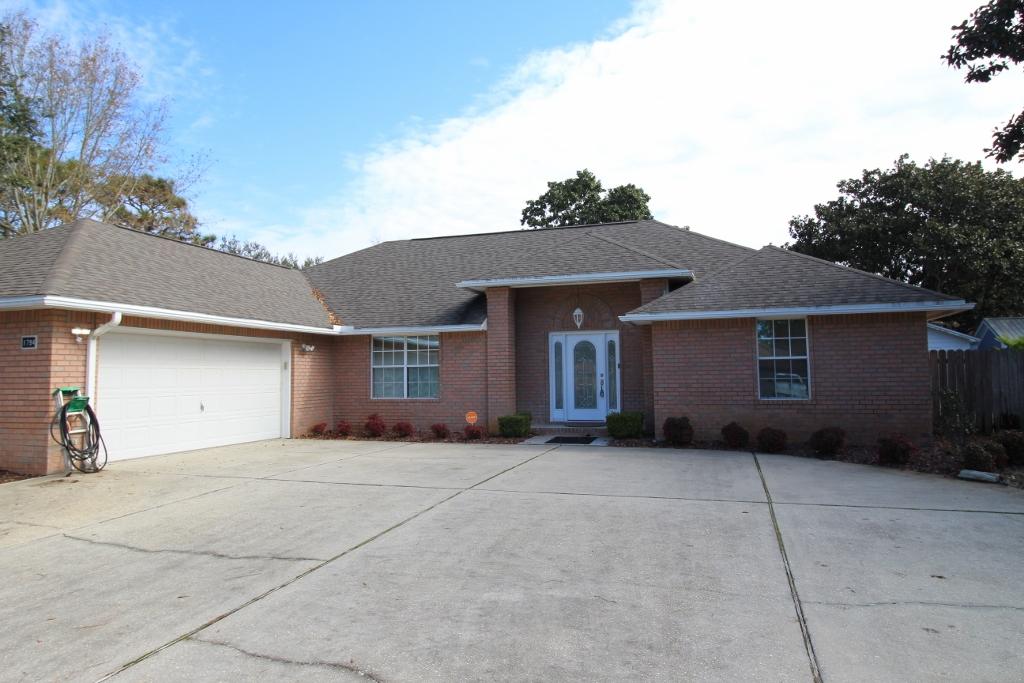 This custom built pool home features an open, split floor plan in a well designed layout. A covered entryway welcomes guests and shields them from the elements, while the leaded glass front door, complete w/sidelights allows natural lighting to flow into the foyer. In the great room, wood laminate flooring perfectly combines style & ease of maintenance; while lighted plant ledges set beneath a cathedral ceiling add to the spacious feel. A corner fireplace, complete w/cultured marble hearth & mantle to ceiling mirror creates a beautiful focal point and surround sound has you set for game day or movie night. In the kitchen, custom wood cabinetry & Corian countertops take center stage! Sliding organizers in the cabinets make ease of storing/finding cookware & the large pantry affords extra storage. The eat-in area has you equipped for weeknight meals, while the adjacent dining room is perfect for entertaining guests. This spacious Master suite has a trey ceiling w/fan & HUGE walk-in closet and the spa-like bath boasts a cultured marble dual vanity, Jacuzzi tub w/separate shower, & water closet. An office on this side of the home has a half bath, access to the garage & an exterior door, allowing it to serve any purpose you'd like. Two additional bedrooms have tile flooring, ceiling fans, a shared hall bath, & extra storage. French doors in the great room open to a Florida room overlooking the sparkling pool, where a half bath allows guests a place to freshen up. An enclosure & robotic cleaner save time on maintenance & a well-fed sprinkler saves money. A shed neatly houses yard/pool tools; while the generator transfer switch provides peace of mind. A new A/C in 2016 & water heater in 2017 have you covered for years to come. This beautiful home features neutral paint tones & attention to detail throughout, proving a perfect backdrop for any style dÃ©cor. Call for your private tour today!