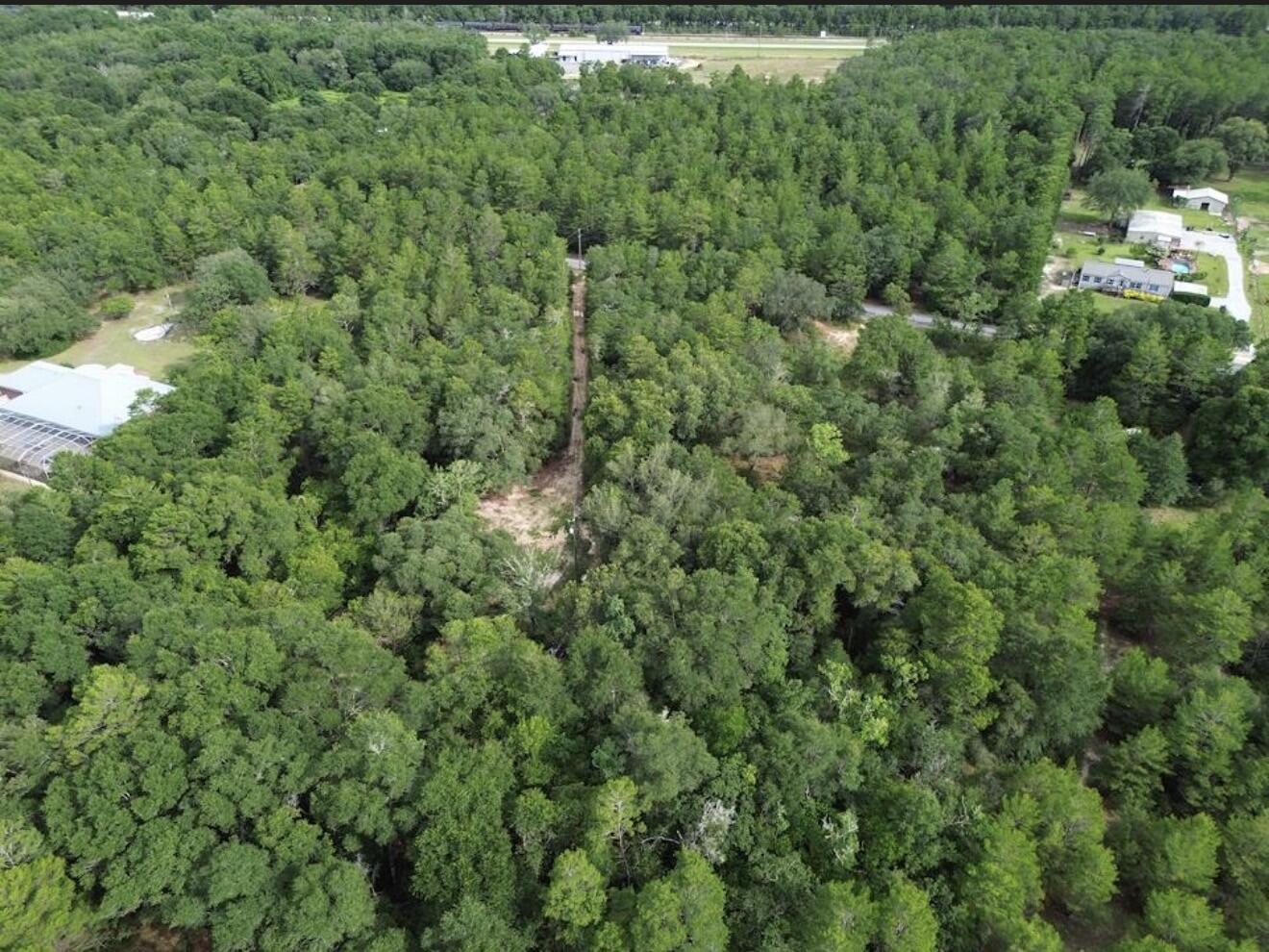 Discover the potential of this 2.55 acre property in DeFuniak Springs, offering plenty of space for your dream homestead, hobby farm, or peaceful country retreat. Located on a paved, county-maintained road, this Rural Residential (RR) property has no HOA and no deed restrictions, giving you the freedom to make it your own. The property includes an older home that is being given no contributory value, making this an excellent opportunity for those looking to renovate, replace, or build. Utilities are already present on the property, including a power pole, though buyers should verify the condition and availability of all existing utility connections, as updates or repairs may be needed. This  property also has an legal easement for access. With open space, existing utility infrastructure, and endless possibilities, this is a great investment for anyone seeking country living with room to grow.