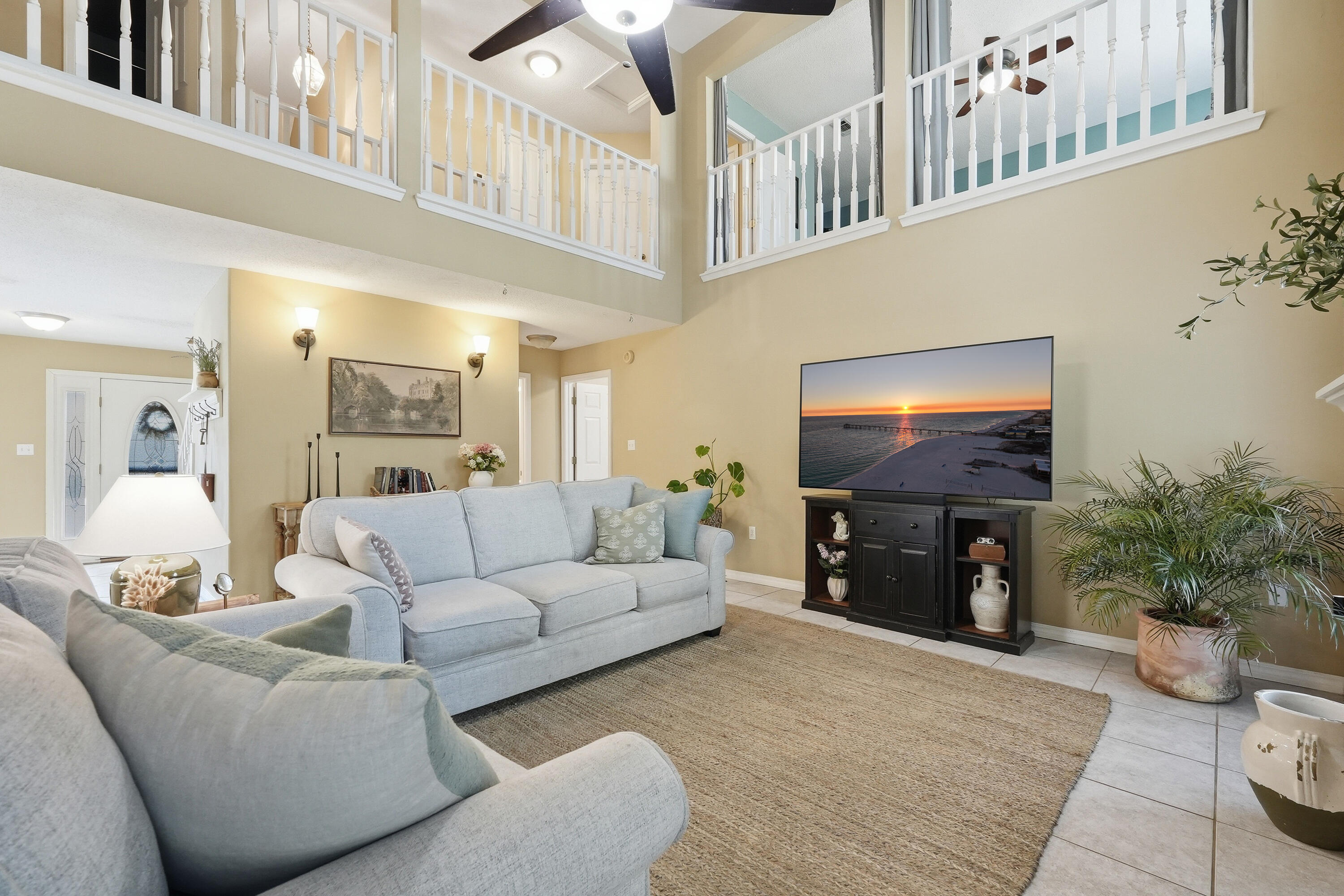 This charming 4 bedroom home with dual living areas and a serene outdoor entertaining space and private oversized backyard  is now available for a new owner. Situated on a wonderful street just 3.4 miles west of Hurlburt Field, you are in close proximity to Navarre Beach, the beaches on Okaloosa Island, bountiful restaurants, shopping and more. Downstairs you will find a dining room, updated kitchen, living room with soaring ceilings, a spacious primary suite, half bathroom for convenience, and a large laundry room. Upstairs, you will find another full bathroom, wonderful additional living space, and three large bedrooms. Reach out today to see how we can make this your next home!