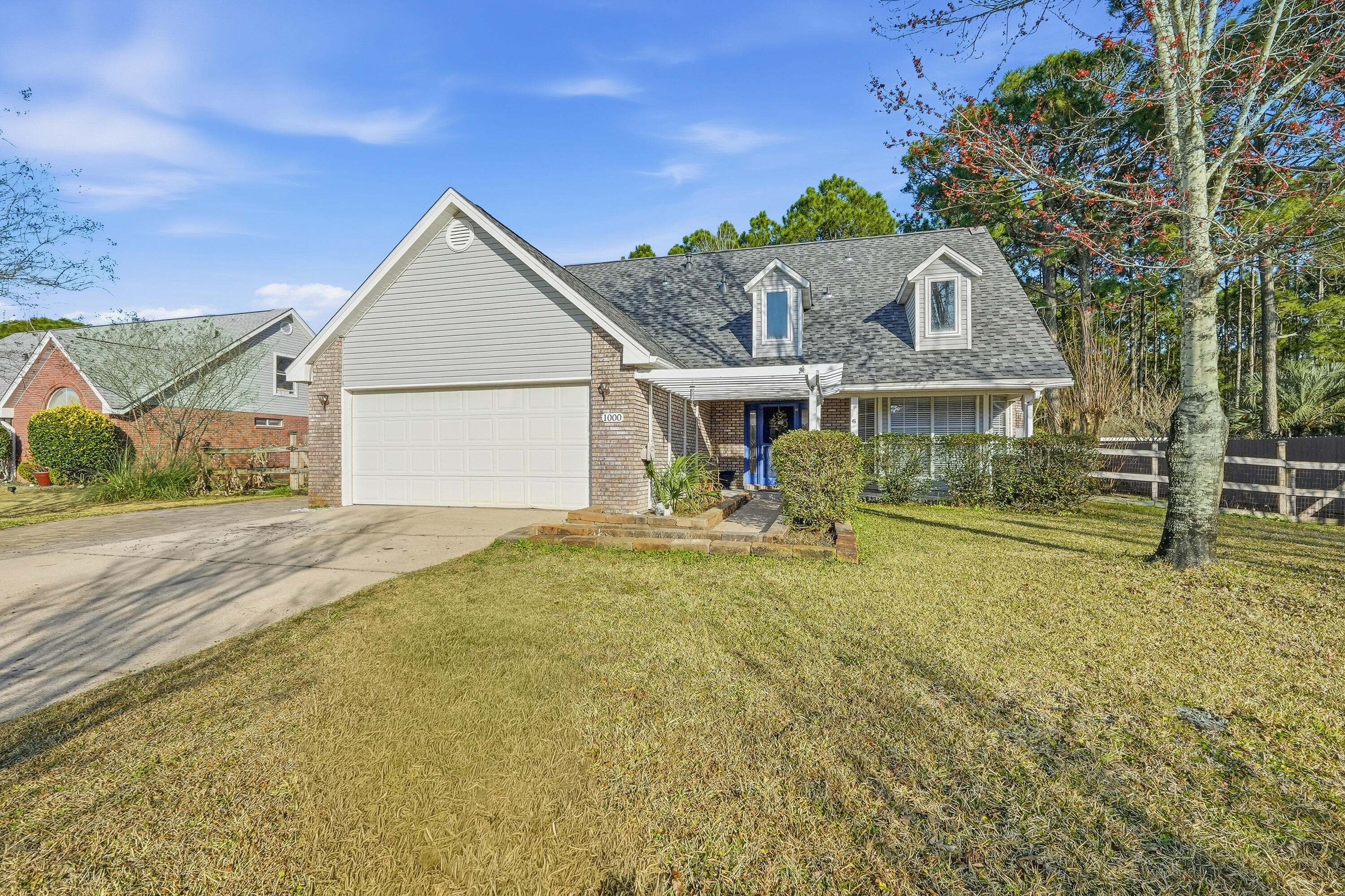 This charming 4 bedroom home with dual living areas and a serene outdoor entertaining space and private oversized backyard  is now available for a new owner. Situated on a wonderful street just 3.4 miles west of Hurlburt Field, you are in close proximity to Navarre Beach, the beaches on Okaloosa Island, bountiful restaurants, shopping and more. Downstairs you will find a dining room, updated kitchen, living room with soaring ceilings, a spacious primary suite, half bathroom for convenience, and a large laundry room. Upstairs, you will find another full bathroom, wonderful additional living space, and three large bedrooms. Reach out today to see how we can make this your next home!