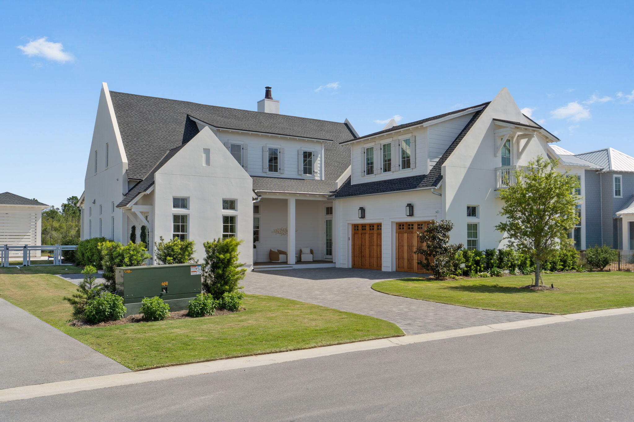 Located in the premier gated community of Watersound Camp Creek, 300 Windsong Drive beautifully captures the essence of coastal elegance in a timeless finish. Superior craftsmanship flows throughout this 5,048 sq. ft., 7 bedroom, 6.5 bathroom home meticulously designed to reflect the refined 30A lifestyle. Impeccably positioned on a pond, the home offers sweeping, unobstructed views of the tranquil surroundings. Upon arrival, the striking curb appeal showcases the upscale slick finish stucco highly favored for its clean aesthetic and polished appearance. Classic exterior design elements are highlighted in the paver driveway, wooden garage doors, premium Cumaru Brazilian hardwood decking and gas copper lantern on the front porch. As you enter the home, the detailed millwork stands out in the custom crown molding, 10'' baseboards and shiplap walls which also leads up the wide staircase. The wood flooring is custom stained 3/4'' white oak unmatched for its natural beauty and sustainability. The entire main level has 12' ceilings creating a sense of airiness and bringing in more natural light from the expansive windows and doors. Stunning custom made window treatments offer functionality and a finished look to complement the impressive architecture.

The heart of the home is the open concept kitchen, dining and living space which is the perfect set up to gather and entertain. The kitchen highlights painted shaker cabinets, quartz countertops, marble backsplash, large 12' island with ample space for extra seating, 48" Wolf gas range, Sub-Zero refrigerator, ASKO dishwasher and built-in microwave, wine cooler and ice maker. Adjacent to the kitchen is a convenient butler's pantry and also a walk-in pantry for extra storage. The living room space offers a 42" natural gas fireplace, quartz surround and rustic mantle. 

Seamlessly transition to the outside through the sleek 16' x 10' sliding glass door as you step into the backyard oasis. Serenity fills the space with relaxing pond views from the pool area blending effortlessly into the beauty of the natural landscape. Gorgeous shell stone pavers surround the pool while Cumaru Brazilian hardwood decking is featured on the covered porch and cabana. The saltwater pool is complete with a hot tub and Baja deck perfect for lounging. The outdoor kitchen in the custom cabana makes entertaining easy with a 36" Artisan gas grill, mini refrigerator, sink and granite counters. Slatted texture walls on the cabana allows for a refreshing breeze to flow through while offering added shade and privacy. 

Thoughtful planning went into the design of the bedrooms to accommodate your needs. Two bedrooms including the primary suite are on the main level. Four bedrooms are on the second level with one of them designed as a bunk room. Additionally, there is a bedroom featured as an attached carriage house complete with a wet bar. The bathrooms are ensuite offering guests a relaxing retreat with marble countertops, beveled floating mirrors and frameless shower glass doors. The bunk room maximizes space and functionality with four built-in bunks. The primary suite features an expansive walk-in closet with island, built-in shoe shelves and several cubbies for extra organization. The spa-like primary bathroom offers a calming space with marble countertops and shower, dual vanity, herringbone marble floor, large soaking tub and water closet. The carriage house presents the best in both proximity and privacy for house guests or multigenerational living. The large laundry room on the main level streamlines organization with built-in cubbies. To further maximize efficiency, there is also a stackable washer and dryer on the second level. 

The home is just 0.3 miles to the Camp Creek amenities making it a desirable location within the community. Watersound Camp Creek owners enjoy the finest in amenities through exclusive membership to the Watersound Club enabling direct access to resort pools, fitness center, private Beach Club, tennis and pickleball courts and top-rated golf courses.