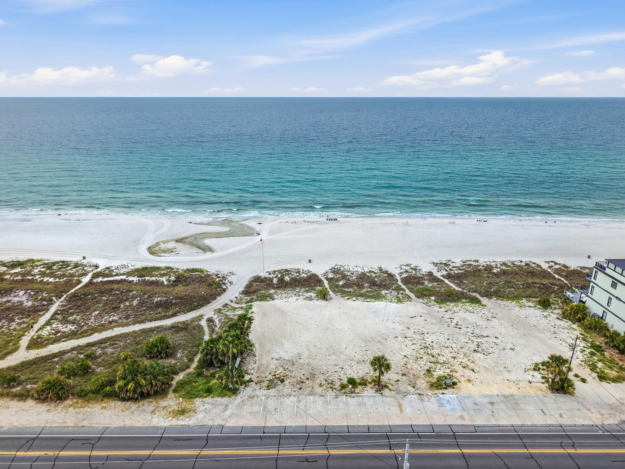 Looking for the perfect West End lot to build a New Beach House, you just found it. THIS LOT IS THE LOT JUST WEST OF EAST END LOT, A 60' WIDE BY 233' DEEPT LOT, one of 4 recently cleared and platted for Single Family Gulf Front lots. This 60' wide lot will be sold with plans for a 4-story Beach House along with a DEP permit, ready to build your new home.   The property meets the new parking requirements to build for a 4 story, 6000 sq. ft. home. The Seller will provide a Survey, permits and plans, all of which is in the document section of the listing.  Additional information regarding a full set of plans with engineering, pricing from builders is as well available and will be supplied during the due diligence period of purchase contract