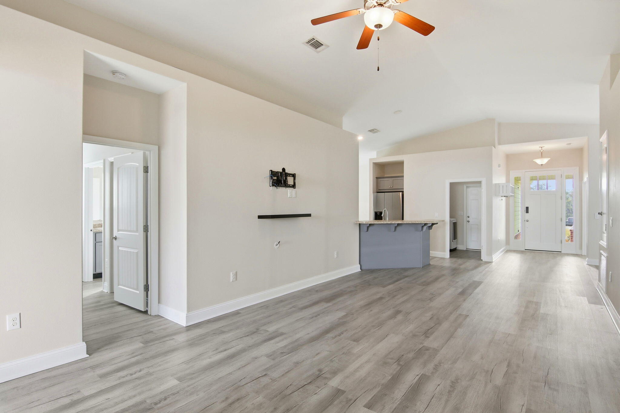 A conveniently located must-see! Fresh interior paint on walls, ceiling, doors, and trim!  Carpet in the two bedrooms has been replaced!  This 4 bedroom, 2 bathroom home in the gated Lafayette Creek Landing is a must see!   Conveniently located next to community amenities, this inviting single-story home offers an open-concept layout with vaulted ceilings that make the main living areas feel bright and spacious. You'll love the newly installed light-toned vinyl plank flooring that runs throughout the common areas, primary bedroom, and fourth bedroom; bringing a fresh, modern aesthetic along with low maintenance.

The heart of the home is the large family room, which flows seamlessly into the kitchen, breakfast nook, and out to the covered lanai; perfect for entertaining or relaxing at home The primary bedroom is tucked away at the back for added privacy and features a tray ceiling, and walk-in closet. The primary's en suite bath offers dual vanities, a soaking tub, and a linen closet.
The split floor plan offers privacy. The three additional bedrooms are located toward the front and side of the home, offering plenty of flexibility for guests, a home office, or extra family space.
This property features a lanai and a fully fenced backyard. It is located directly next to the clubhouse, pool, mailboxes, and additional parking. The Lafayette Creek Landing Community has so much to offer it's residents: clubhouse with kitchen, party room, lounge area, bathrooms, and fitness room; community pool; nature trail to the creek; and a community dock overlooking the lake.
This home is conveniently located less than a half mile from shopping, restaurants, and Publix! What's more?! It's located less than 15 miles from the sugary white sand beaches of the Emerald Coast!