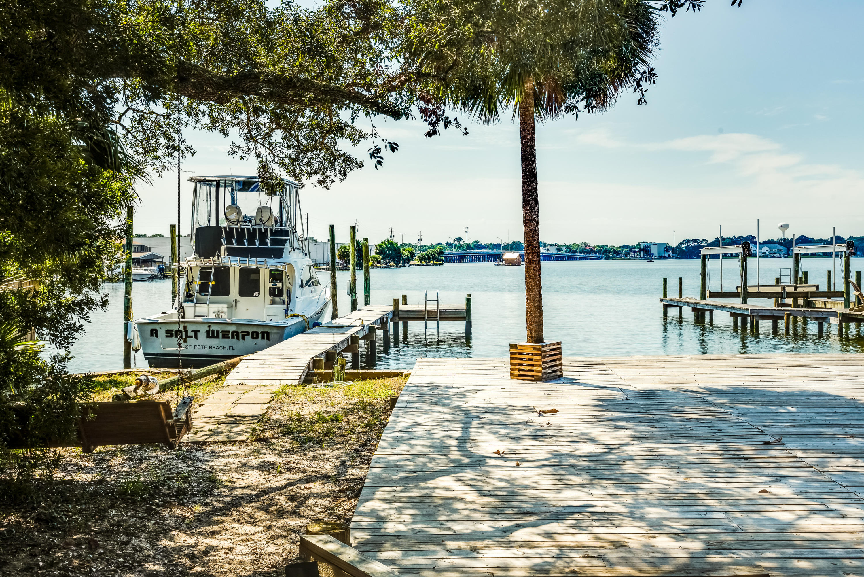 The living is easy in this impressive , generously proportioned waterfront residence! Right on Cinco Bayou and NOT in a flood zone.
The floor plan encompasses 3 Spacious bedrooms with plenty of room for study, sleep and storage, 2 bathrooms. The master has a deep walk-in-shower, a completely updated sleek and stylish kitchen that flows into a well-lit great room that combines dining and lounging space.
The master bedroom comes complete with an absolute must see walk-in-closet that elongates the length of the room & connects the bath & laundry room
Saving the best for last....THE BOAT DOCK over looking Cinco Bayou, whether you need the perfect place for your boat, whether you love to fish or if you just want the best spot in town to watch the sunset..this one has it ALL!