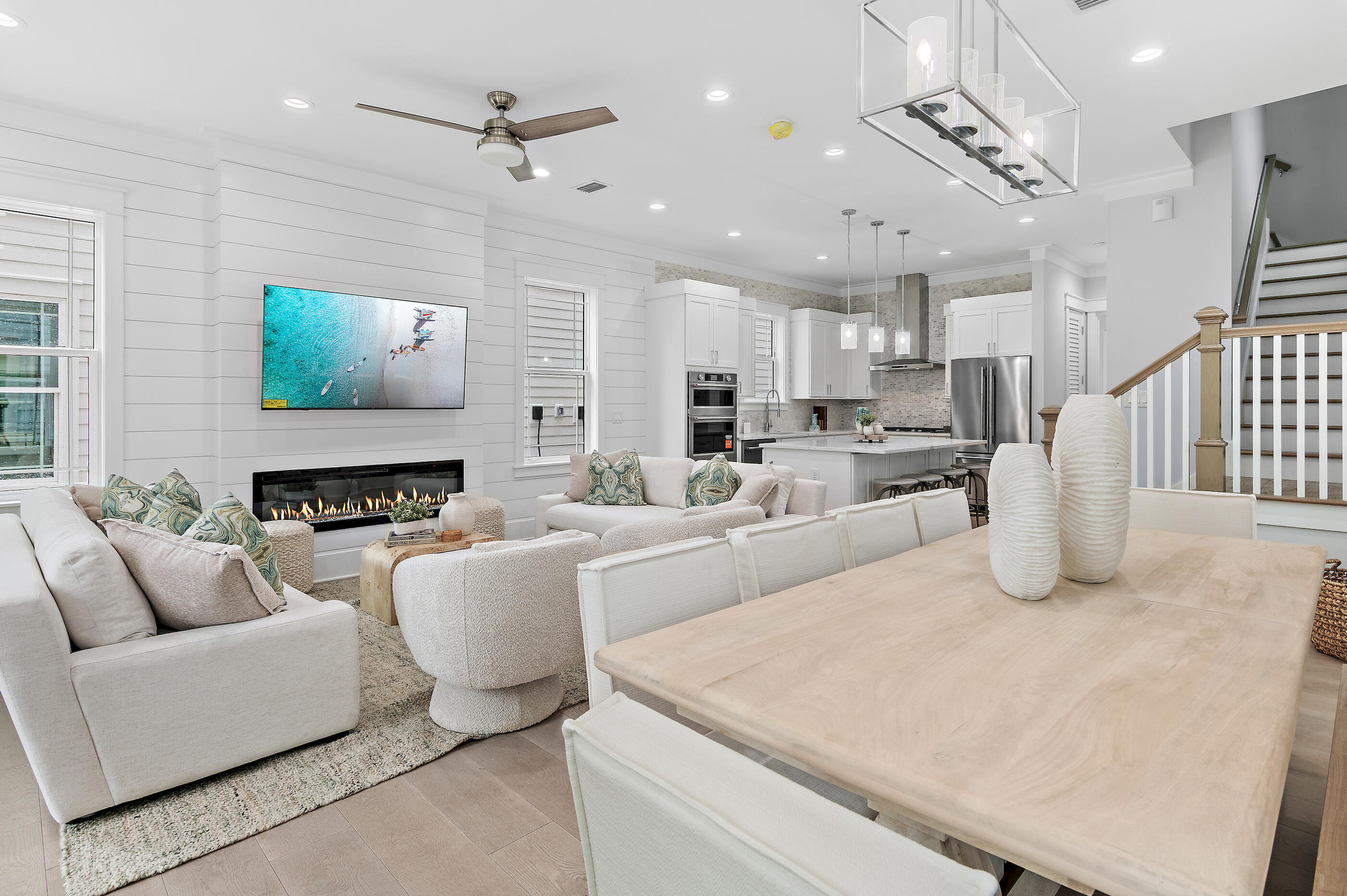 Tucked within the sought-after Seacrest Beach community along scenic 30A, this beautifully crafted new construction home delivers an effortless blend of upscale design and easygoing coastal charm--and it's offered fully furnished. With five spacious bedrooms and four and a half baths, the home showcases wide-plank engineered wood flooring throughout, creating a warm, cohesive feel across every level. Thoughtfully designed for both privacy and togetherness, the floor plan features two primary suites--one on the first floor and another on the top level--making it ideal for hosting guests or accommodating multi-generational living. Three separate living areas provide plenty of room to spread out, whether gathering as a group or enjoying quiet downtime. The first-floor living space anchors the home with a striking 72-inch electric fireplace that adds a contemporary touch and inviting ambiance. Upstairs, the second level offers an additional lounge area that flows seamlessly onto a covered porch, perfect for catching coastal breezes or entertaining with ease. The kitchen is both functional and stylish, featuring shaker-style cabinetry, quartz surfaces, a designer tile backsplash, and high-end appliances suited for everyday living or special occasions. Nearby, a well-appointed wet bar--complete with open shelving, a wine fridge, and an ice maker--enhances the home's entertaining appeal.

The third floor presents yet another living space along with an expansive balcony featuring a summer kitchen and beautiful Gulf views, creating an ideal setting for sunset gatherings or relaxed evenings overlooking Scenic 30A.

Modern conveniences include a Rinnai tankless water heater for endless hot water, as well as an in-home washer and dryer for added ease.

Residents of Seacrest Beach enjoy access to a convenient community shuttle, making trips to the Gulf's sugar-white sands simple and stress-free. Beyond the beach, you're just moments from the charming towns of Rosemary Beach and Alys Beach, where boutique shopping, dining, and local favorites await. Outdoor recreation is abundant, from nearby golf at Camp Creek to kayaking, hiking, and fishing at Camp Helen State Park along the peaceful shores of Lake Powell.