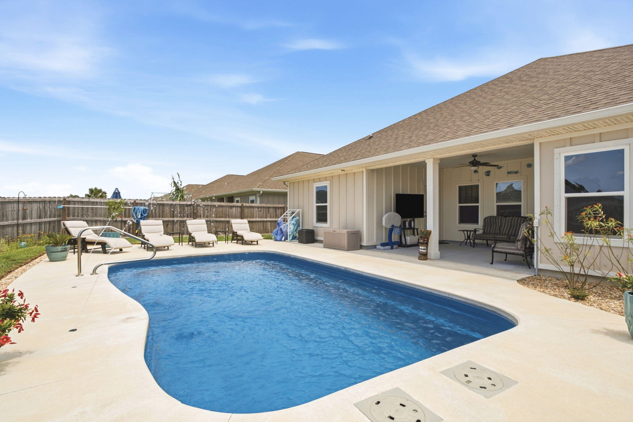 Welcome home to one of the area's most impressive newer construction pool homes, thoughtfully designed with luxury, comfort, and functionality in mind. From the moment you arrive, you'll appreciate the stunning curb appeal, oversized three-car garage, and meticulously maintained landscaping that sets this property apart from the rest.

Inside, you'll find an open and inviting floor plan featuring four spacious bedrooms, three full bathrooms, and a rare bonus office space that many comparable floor plans simply do not offer. Custom carpentry and modern wall accents add character and sophistication throughout the home, while soaring tray ceilings and an abundance of natural light create a bright and airy atmosphere.

The heart of the home is the expansive kitchen, complete with a massive center island, generous cabinetry, and all appliances conveying with the sale--perfect for entertaining family and friends. The private owner's retreat is tucked away overlooking the pool and offers a true spa-like experience with a separate soaking tub, walk-in shower, and oversized walk-in closet.

Step outside and prepare to fall in love. The backyard is truly a showpiece, featuring a custom-designed pool with elegant hardscaping, beautiful fountains, and resort-style finishes. Every detail has been carefully planned and maintained--from the lush lawn and mature palms to the decorative rock landscaping--creating a backyard oasis you'll enjoy year-round. The third full bathroom conveniently offers direct access to the pool area, making outdoor living effortless.

Located in a desirable community with sidewalks, underground utilities, low quarterly HOA dues, and an easy commute to Pensacola, Fort Walton Beach, and Destin, this home offers both luxury and convenience. Enjoy breathtaking sunrises, stunning sunsets, and the peace of mind that comes with being outside of a flood zone while benefiting from low insurance costs.

Rarely do pool homes of this caliber become available at such an attractive price point. Professional photography will be available soon. Sellers are seeking a late July or early August closing date. Pre-approved buyers only, please.

This is more than just a home--it's a lifestyle. Schedule your private showing today and discover why you'll fall in love the moment you arrive