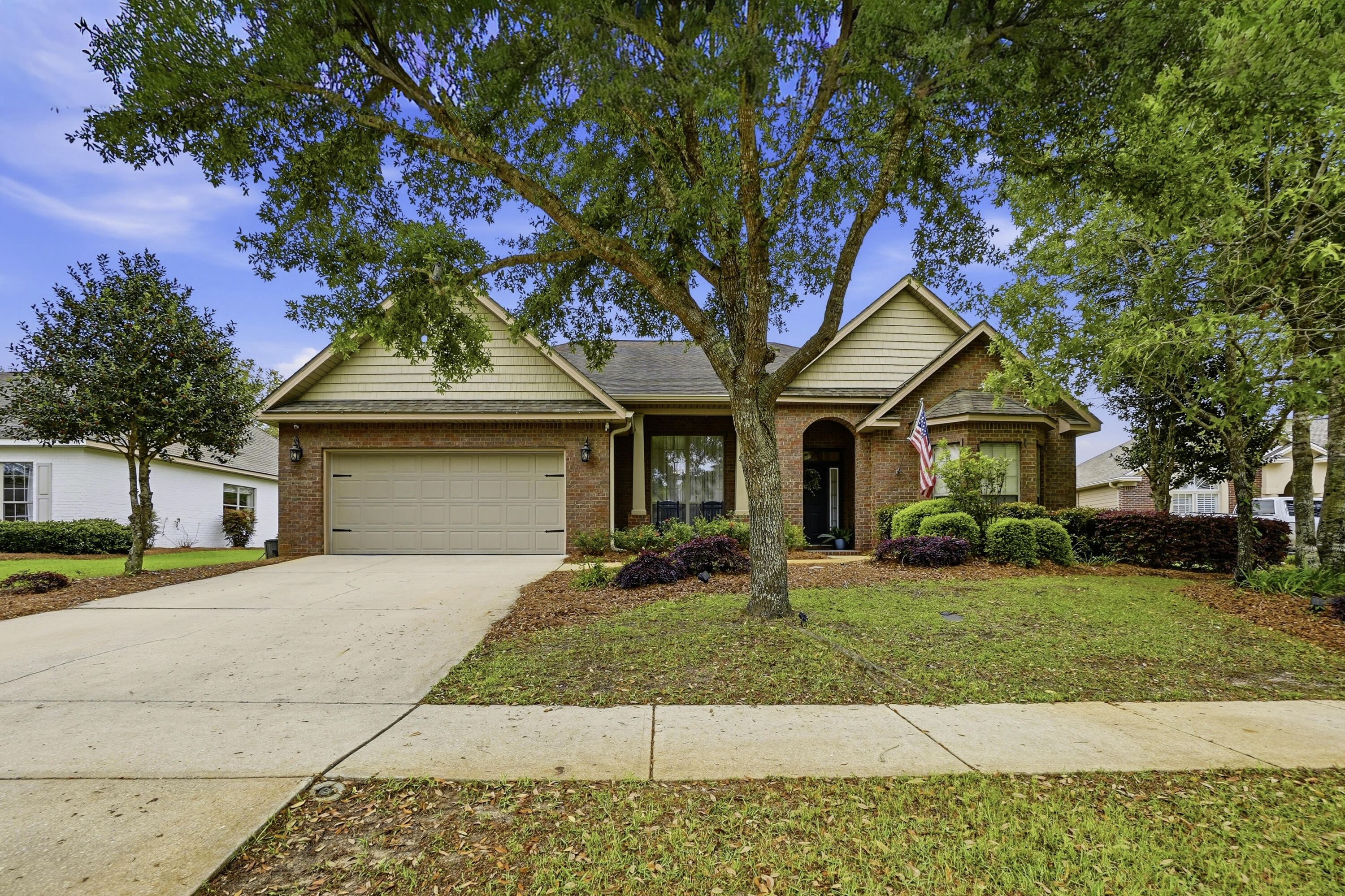 Welcome to this beautifully maintained home in Orchards at Hammock Bay, where modern style meets everyday functionality.  This thoughtfully designed property features three bedrooms plus a versatile flex room, large, laundry room, an eat in kitchen as well as a beautiful dining room. At the center of the home, the spacious great room creates a warm and inviting gathering space, highlighted by a stunning shiplap fireplace. The open concept layout flows seamlessly into the spacious kitchen. The primary bedroom has a great sitting area or office nook. The generously sized back yard offers an oasis with a screen porch,paver patio and custom built pergola overlooking a the lake. New HVAC installed 2025. Hammock Bay offers pools, fitness, trails, dog park and many more amenities.Seller to add a new roof at closing with an acceptable offer.