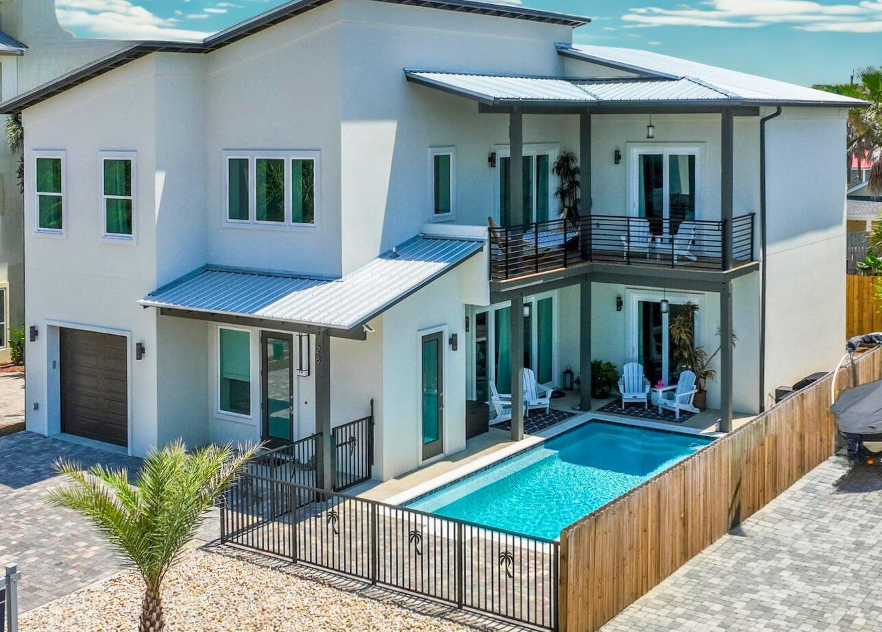 BRING AN OFFER!   NO HOA!! STUNNING CUSTOM HOME NEW IN 2022, POURED SOLID CONCRETE. Did I mention NO HOA FEES IN PRESTIGIOUS FRANGISTA BEACH. CALL LESLIE 850-502-3988  

Only a 5 minute walk to a deeded beach access. Walk into a 28-foot Foyer with open floor plan. See the sparkles from the chandelier when sun lights it up. TWO LARGE LIVING ROOMS.  Each bedroom has its own ENSUITE.  PRIMARY ON MAIN OR SECOND WITH POOL VIEWS.  Kitchen is to die for with Chefs Kitchen and appliances with amazing surprise addons!
A 50lb built in ice machine keeps Parties Alive in the heated Salt Water pool with a 25 foot inside pool bench. Large open pocketed impact slider doors on both levels. 

Home is Sold Furnished with a few exceptions of personal Items and Antiques.  Cost to Own a Concrete Home is MINIMAL AND WILL BE THE HOME WITH NO YEARLY WOOD ROT, HIGH INSURANCE OR ELECTRIC BILLS.  

NO HOA!  NO HOA!
