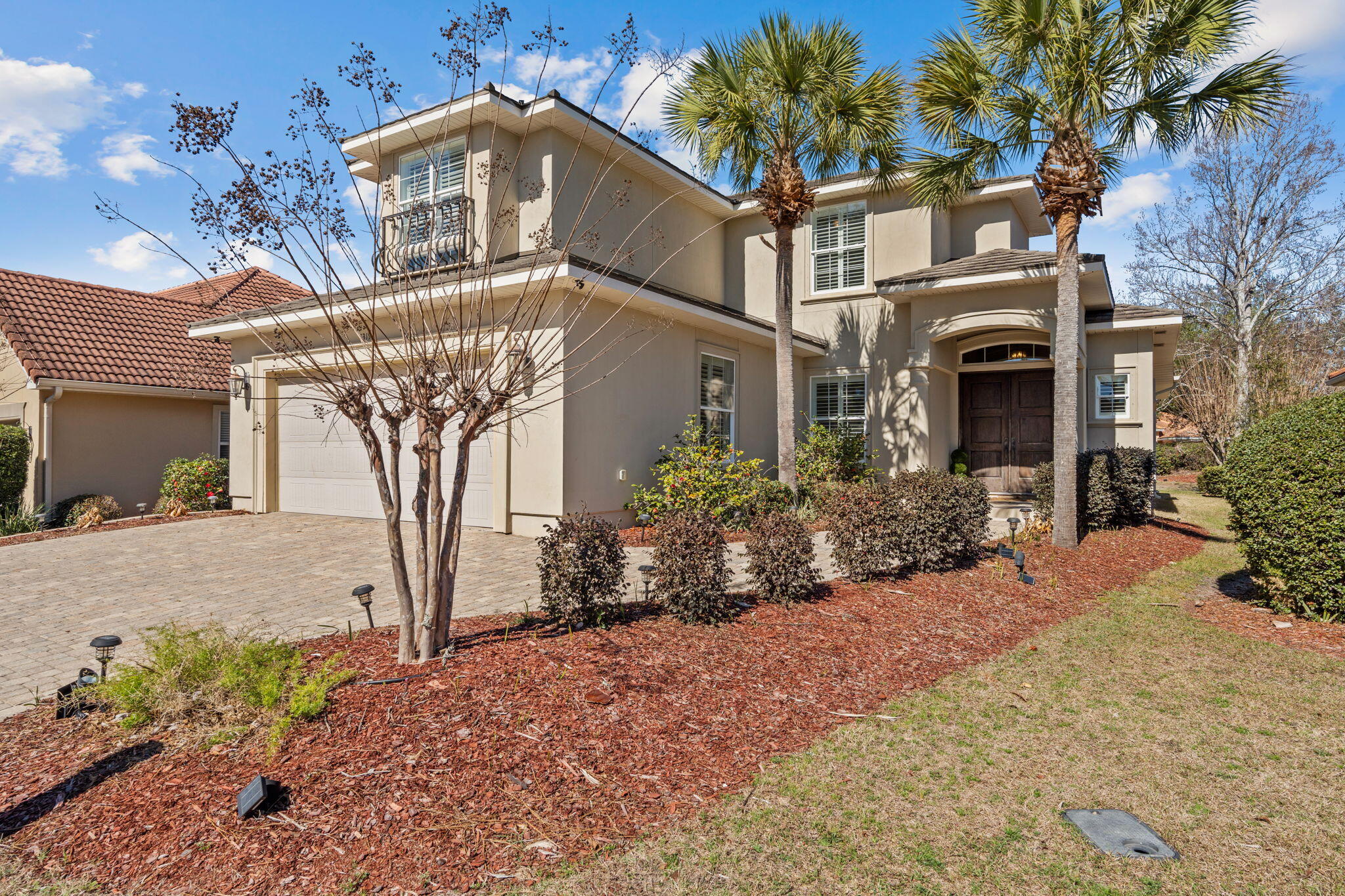 See Additional Remarks--- Experience refined coastal luxury at 4319 Sunset Beach Circle, a custom-built residence in the exclusive guard-gated community of Sunset Beach within Bluewater Bay. Offering 3,107 square feet of thoughtfully designed living space, this exceptional home blends elevated design, superior craftsmanship, and energy-efficient construction into one impressive package.

A pavered drive and Versailles-pattern travertine walk lead to a covered entry accented with tongue-and-groove wood ceilings and grand mahogany double doors with aged bronze hardware. Inside, natural light pours into the expansive main level where soaring ceilings and seamless travertine flooring connect the formal dining area, great room, chef's kitchen, and breakfast nook. The scale is both dramatic and welcoming, perfectly suited for intimate evenings or larger gatherings.

Extensive millwork, custom casings, and curated finishes elevate every space. The great room showcases 22-foot ceilings, statement chandeliers, a gas fireplace, and custom built-ins, all flowing effortlessly into a designer kitchen outfitted with professional-grade stainless steel Viking appliances, including dual convection ovens, a five-burner gas range with pot filler, and a Viking refrigerator. An oversized island with prep sink and beverage station anchors the space, while soft-close cabinetry and a generous walk-in pantry provide abundant storage without sacrificing style.

The primary suite is privately situated on the main floor behind double eight-foot doors, offering a serene retreat with a spa-inspired bath featuring dual vanities with Carrara marble tops, a soaking tub, walk-in shower with dual heads, private water closet, and spacious walk-in closet.

Outdoor living is equally impressive. French doors and sliding glass panels open to a large covered porch complete with tile flooring, wood-paneled ceilings, and ample space for lounging or dining. Pre-plumbed for gas, water, and electric, the area is ready for a future summer kitchen. Beyond, mature landscaping and a generous sodded lawn create a beautiful and functional backyard setting.

Upstairs, two oversized bedrooms each enjoy private en suite baths, while a fourth bedroom--currently used as an office--offers flexibility along with a finished, climate-controlled walk-in storage space.

Built with 2x6 construction, spray fiber insulation, and foam roof decking, the home is designed for efficiency and durability. A DECRA stone-coated steel roof with, NEW Rinnai tankless water heater, dual Lennox heat pumps, Manabloc plumbing system, surround sound, and Kevlar hurricane shutters further highlight the home's commitment to quality and performance.

Residents of Sunset Beach enjoy exclusive access to Niceville's only bayfront, resort-style pool, private sandy beach, clubhouse, and 24-hour manned security, with HOA dues that include lawn maintenance and lawn irrigation.

A custom home of this caliber, in this location, is a rare offering--thoughtfully designed, impeccably finished, and positioned within one of Niceville's most desirable waterfront communities.