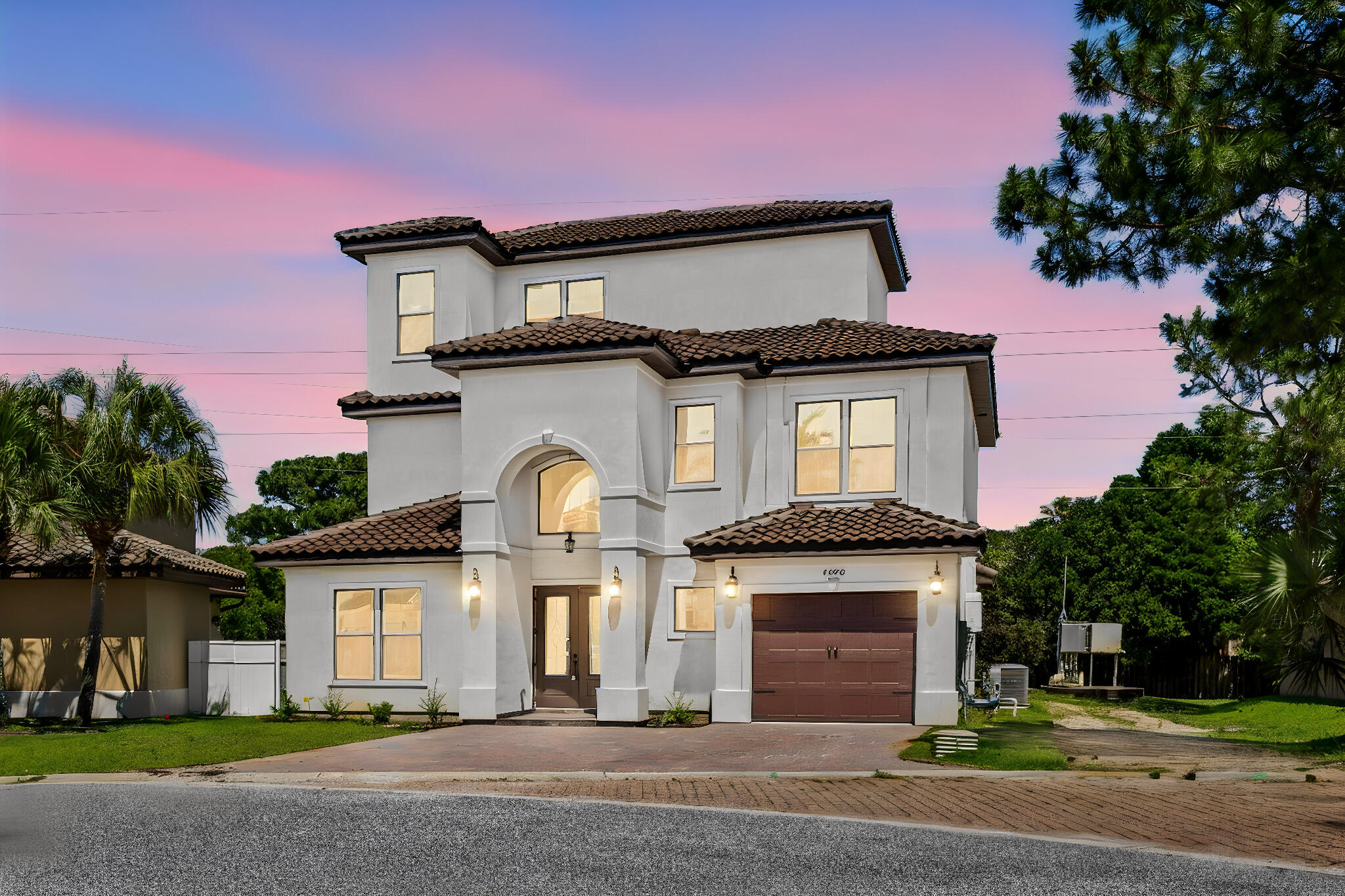 Experience luxury coastal living in this exceptional 3-story home in the gated community of Calusa Bay. Offering 4 bedrooms, 4 bathrooms, and an open floor plan with 10' ceilings, crown molding, a vented fireplace, white porcelain tile on the first floor, hardwood floors on the second and third levels, and ceiling fans throughout. The gourmet kitchen features granite countertops and backsplash, a 4' x 10' island with large sink, walk-in pantry, pot filler, Thor range, Thor dishwasher, Thor wine cooler, ZLINE microwave, and dual Fisher & Paykel refrigerator. A curved staircase and modern chandelier create an impressive foyer. The first floor includes a powder room. Upstairs offers a spacious loft with balcony, laundry room with sink, three guest bedrooms, including two connected by a Jack-and-Jill bath, plus a luxurious primary suite with a garden tub and oversized shower with three shower heads. Enjoy the private backyard with a built-in BBQ grill, perfect for entertaining. Community amenities include a gated entrance and pool. Regatta Bay Golf & Yacht Club is just minutes away, offering optional membership with golf, pickleball, tennis, lap pool, and dining. Conveniently located near Destin's beaches, shopping, dining, and entertainment.