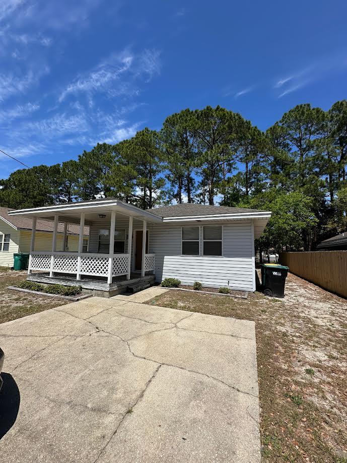 Charming Florida-style cottage located west of Hurlburt Field in desirable Wynn Haven Beach! This inviting 2-bedroom, 1-bath home offers comfortable living space and is full of character. Enjoy relaxing on the covered front porch or step inside to a bright and welcoming interior designed for both comfort and functionality. The home features a spacious living area, well-sized bedrooms, and a full bathroom for everyday convenience. An inside laundry room with washer/dryer hookups adds to the practicality of the home. The large fenced backyard provides ample room for outdoor enjoyment. Located in the heart of Mary Esther, this home is just minutes from Hurlburt Field, making it an ideal choice for convenience and lifestyle. Sorry no pets. All Coastal Realty Services residents are enrolled in the Resident Benefits Package (RBP) which includes renters insurance, HVAC air filter delivery (for applicable properties) and our best-in-class resident rewards program, and much more!