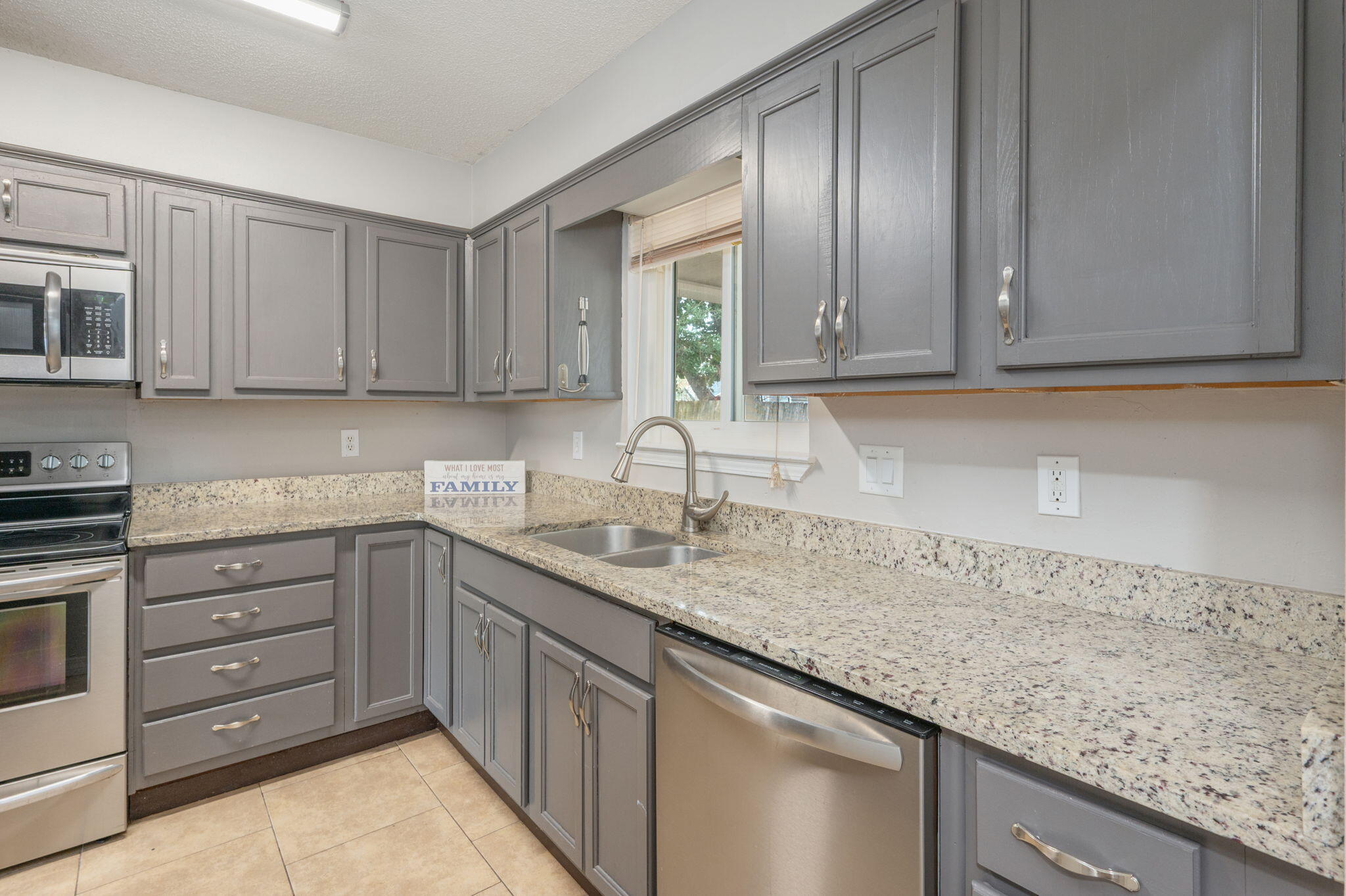 Spacious end-unit townhome with updates and smart features throughout.  Perfect location for Eglin or Hurlburt field access! This home delights with a large yard and covered porch. Kitchen is trendy with slate blue cabinets, granite counters, pantry and stainless appliances. Double vanities, half bath, upgraded fixtures and natural light. Plenty of storage, and indoor laundry room.  Smart lighting, nest thermostat and keyless entry! Extra parking in front with covered carport. Seller to replace roof prior to closing.