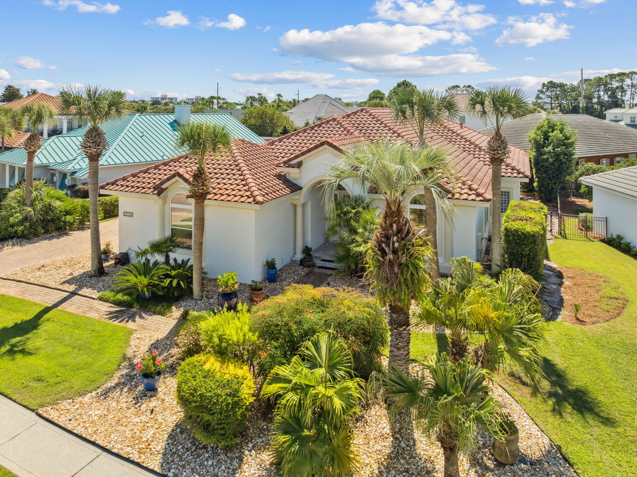Fully renovated, turnkey beach home in the highly sought-after gated Destiny East community, just a short distance to public beach access. Meticulously maintained as a primary residence, this one-story home is move-in ready and showcases a no-expense-spared modern coastal renovation. Features include a private pool and spa with screened enclosure, open-concept floor plan, high ceilings, custom finishes, and designer interior and exterior lighting. Offered furnished for immediate enjoyment or rental potential. Comparable 4-bedroom homes in Destiny East on rental programs have generated over $80,000 annually. Resort-style amenities include two pools, hot tub, clubhouse with movie theater, fitness center, tennis courts, basketball court, BBQ area, walking trails, and playground.