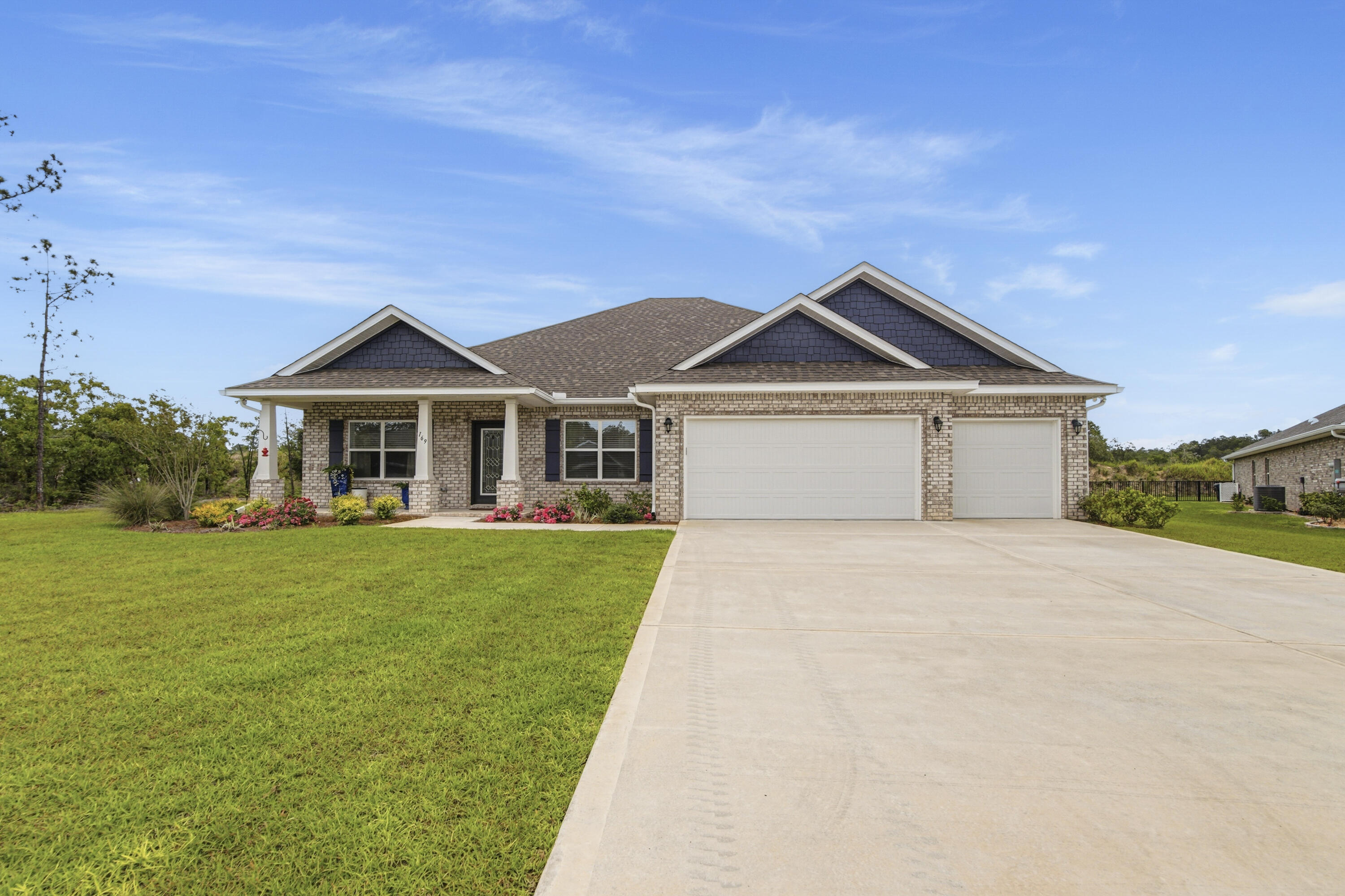 Welcome to 169 Bentgrass Rd S, a beautifully crafted 2025 home nestled within the gated golf community of Windswept Estates. Perfectly positioned at the end of a quiet cul-de-sac on a generous ½-acre lot, this property offers both privacy and stunning views as it backs directly to the 4th fairway of Windswept Dunes Golf Course. This thoughtfully designed home features 3 bedrooms, 3 bathrooms, and over 2,600 square feet of living space, along with a spacious 3-car garage. Inside, you'll find all ceramic tile flooring throughout, elegant crown molding, and a light, open layout ideal for both everyday living and entertaining. The gourmet kitchen is a standout, complete with quartz countertops, an abundance of cabinetry, and a large walk-in pantry providing exceptional storage. Quartz surfaces continue throughout the bathrooms, adding a cohesive and upscale finish. The owner's retreat offers a true sanctuary with additional space in the bedroom, perfect for a sitting area or private retreat. Step outside and experience the peaceful setting this home provides. Enjoy quiet mornings listening to birds, watching hummingbirds, and taking in the serene golf course views. This is a community where life moves at a slower, more enjoyable pace, and neighbors are known for being friendly and welcoming. Select furnishings are negotiable, including a 2025 Evolution Ranger 2+2 Pearl White 4-seater golf cart featuring an 84-month transferable warranty. The garage is equipped with a Gladiator Garage-Ready refrigerator/freezer set and new Firman 3-fuel generator and new window AC ready for hurricane season. Additional furnishings may be included--please ask the listing agent for details. Experience refined living in one of Freeport's most sought-after golf communities--where comfort, quality, and lifestyle come together.